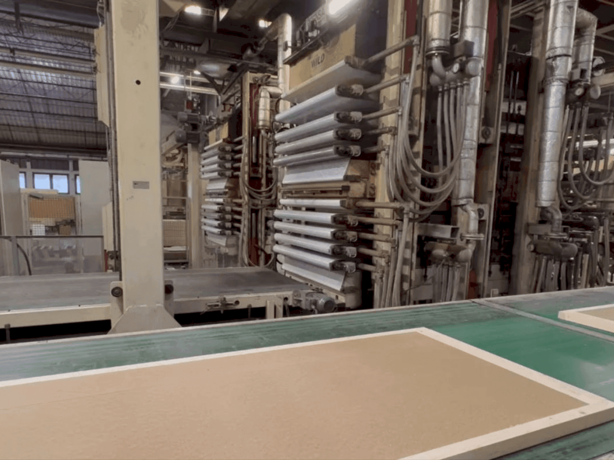 Front view of WILD Door leaf press line machine