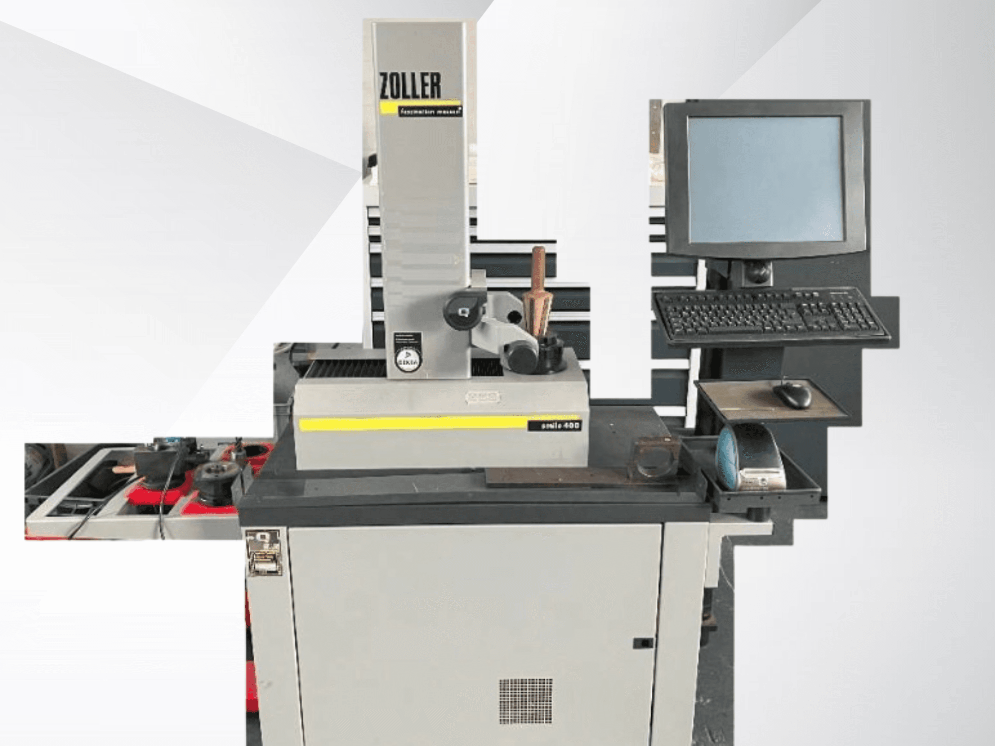 ZOLLER measuring machine with computer monitor, keyboard, and tools; front view showing gray color and modern design.