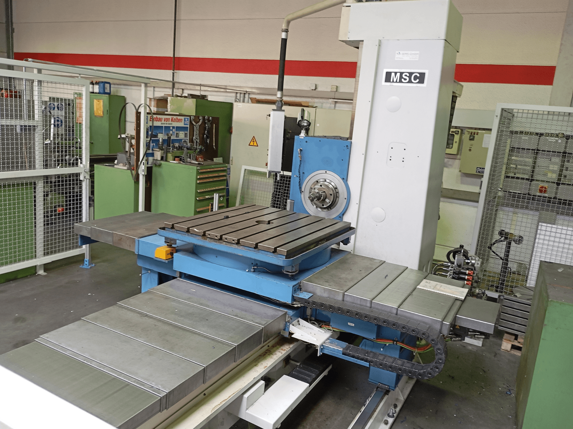 MSC BFT 90/5 TNC 320 boring machine, side view, features a metal worktable and tool holder in a workshop setting.