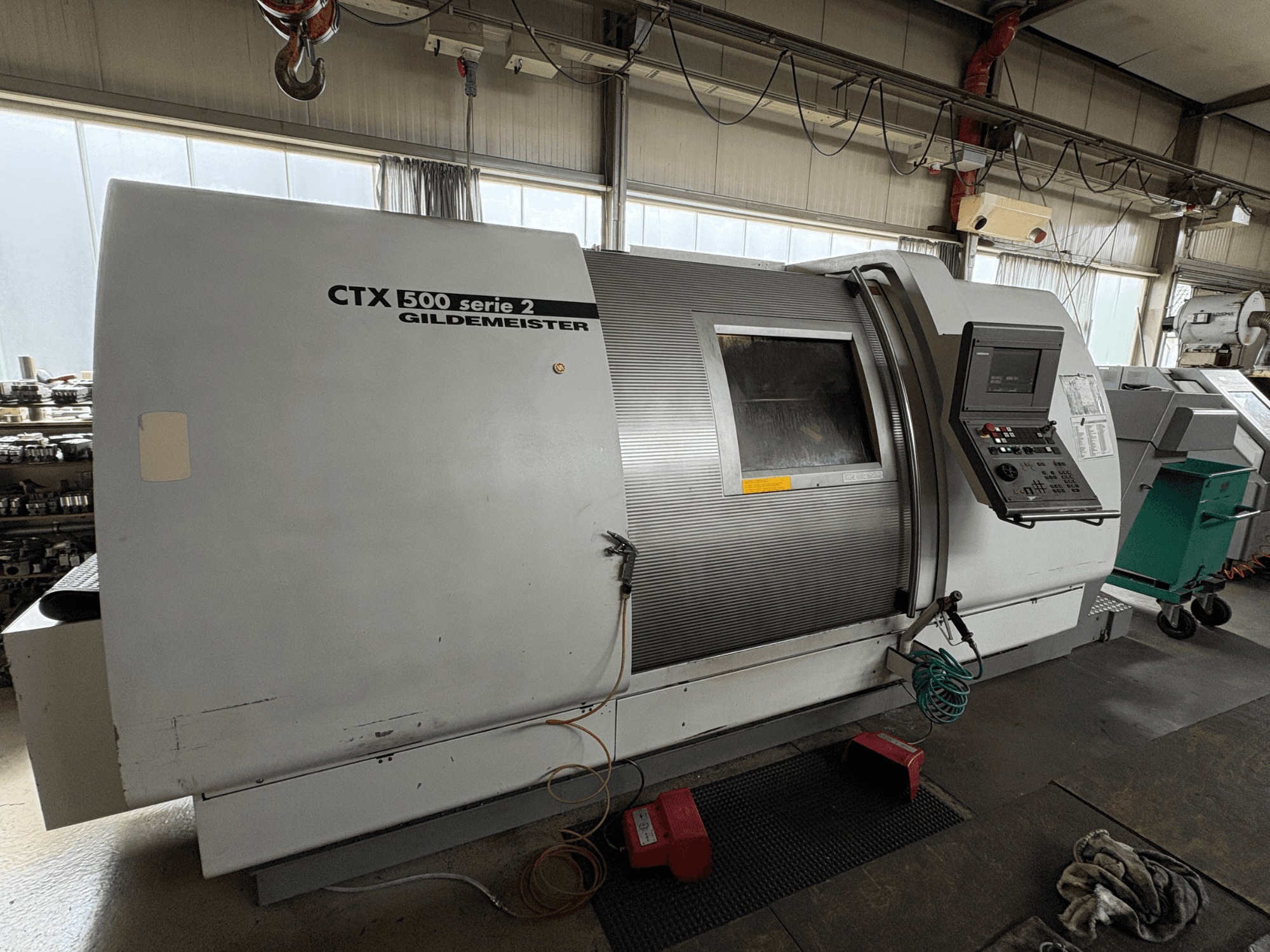 Horizontal turning machine Gildemeister CTX 500 S2, side view, showcasing control panel and main body details.
