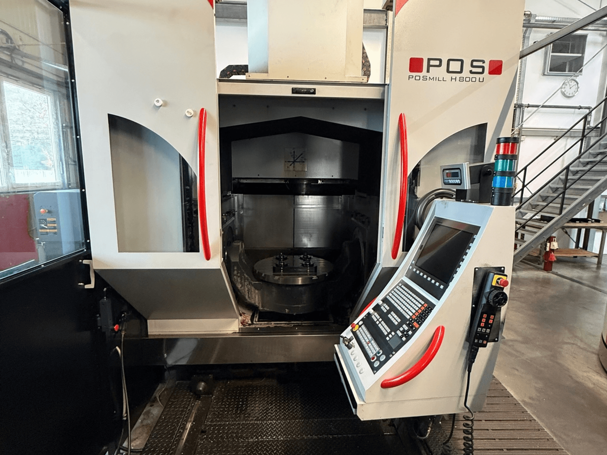 POSmill H 800 U vertical machining center, front view showing control panel and open access to the working area.