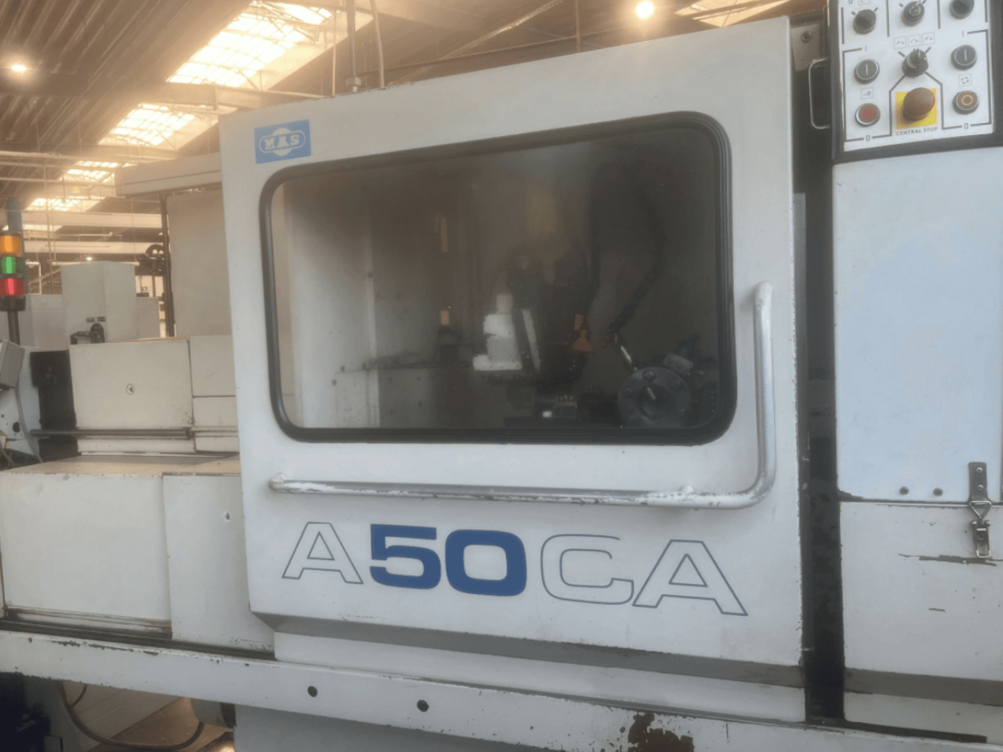 Horizontal turning machine KOVOSVIT MAS OPTIMAT A50CA, front view showing controls and internal components.
