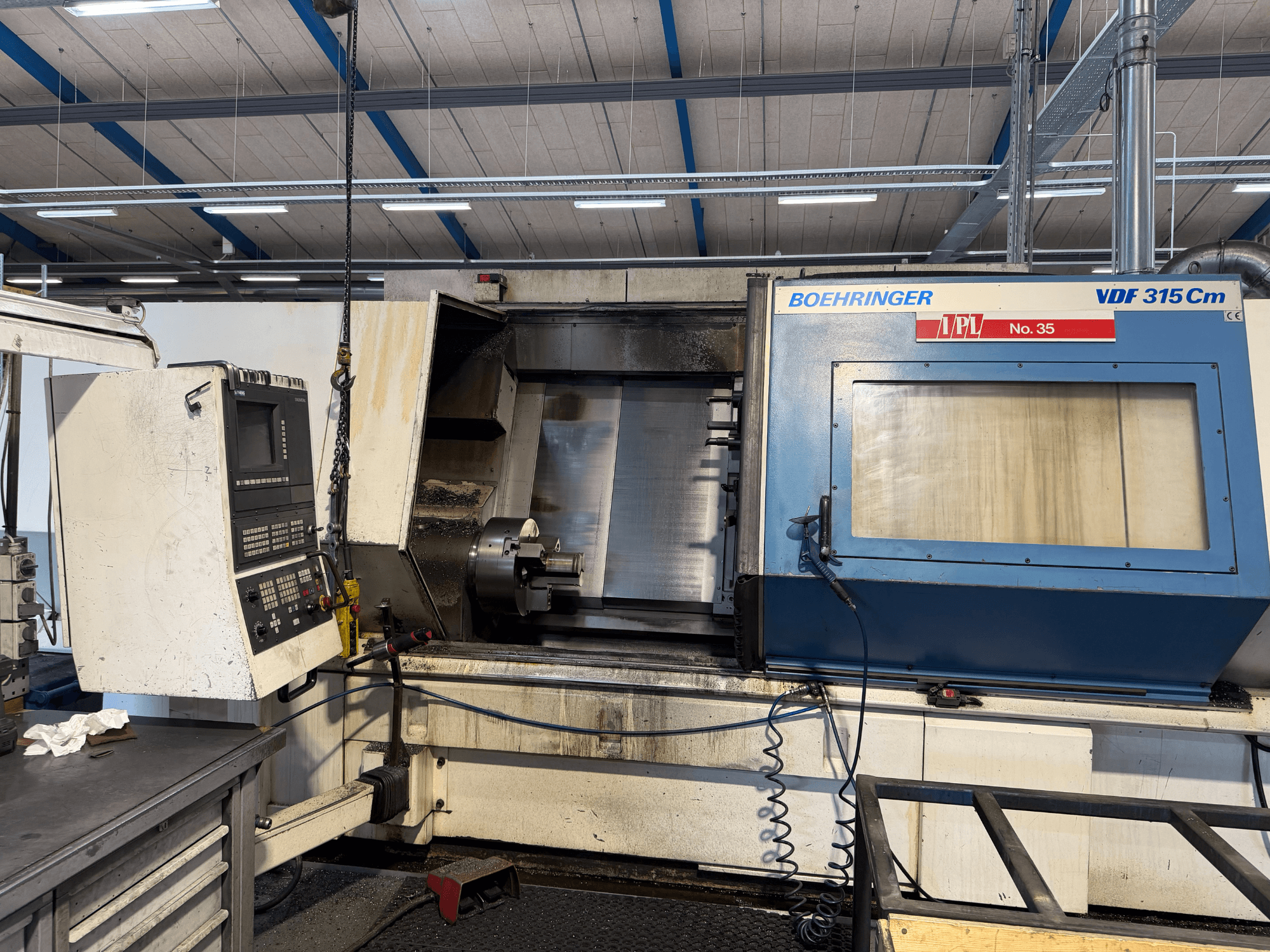 Front view of BOEHRINGER VDF 315 CM horizontal turning machine, featuring a control panel and open machining area.