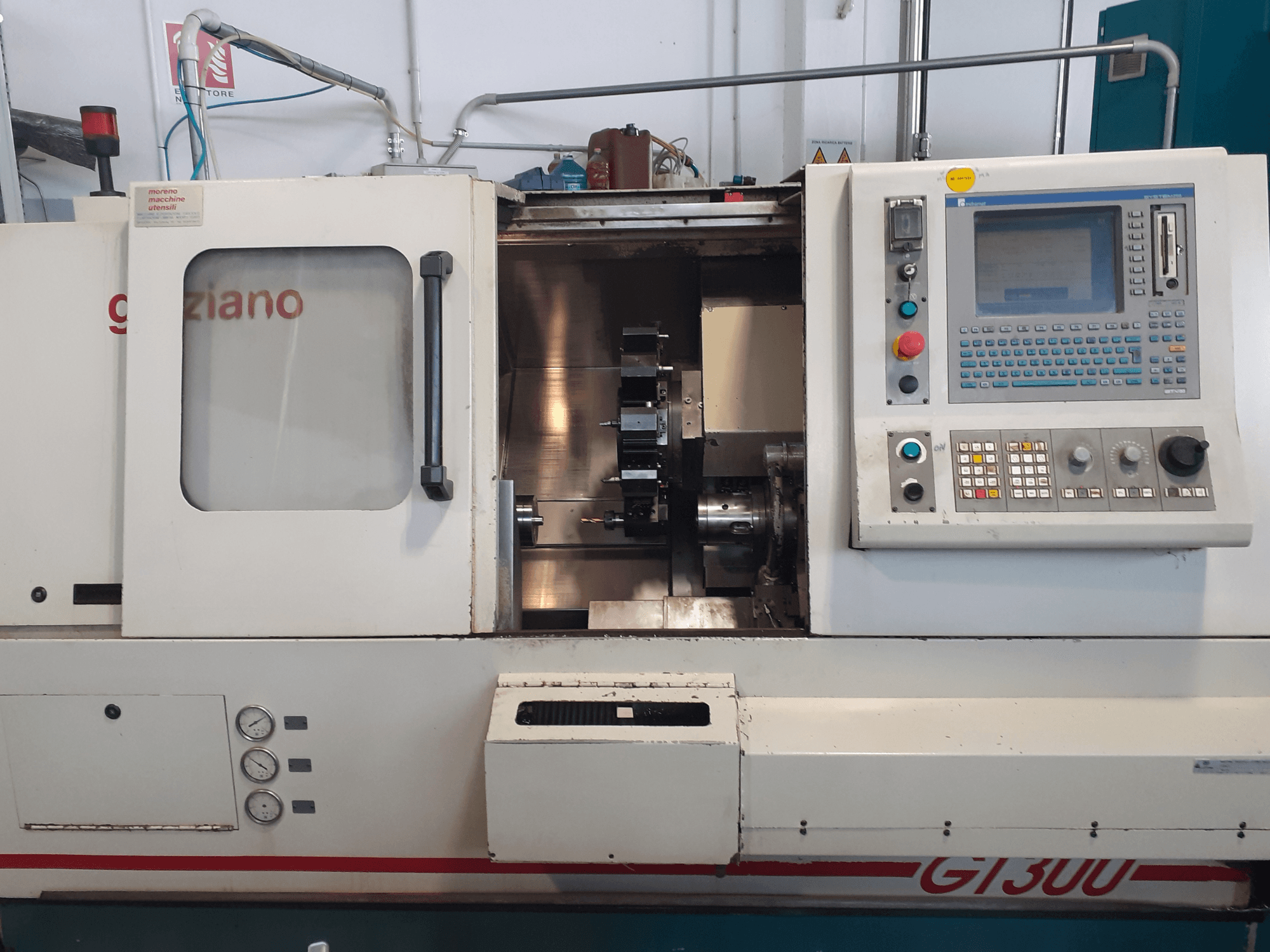 Graziano GT 300 horizontal turning machine, front view with control panel and visible machining interior.