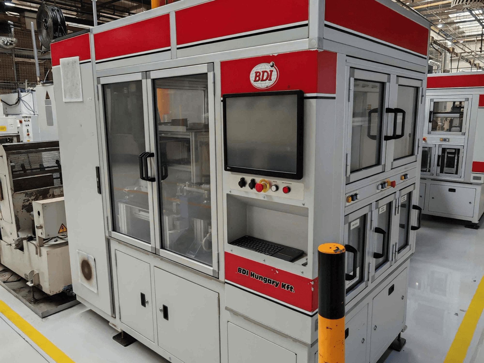 Cylindrical grinding machine by Estarta, model 318 MV, front view showing control panel and glass doors for inspection.