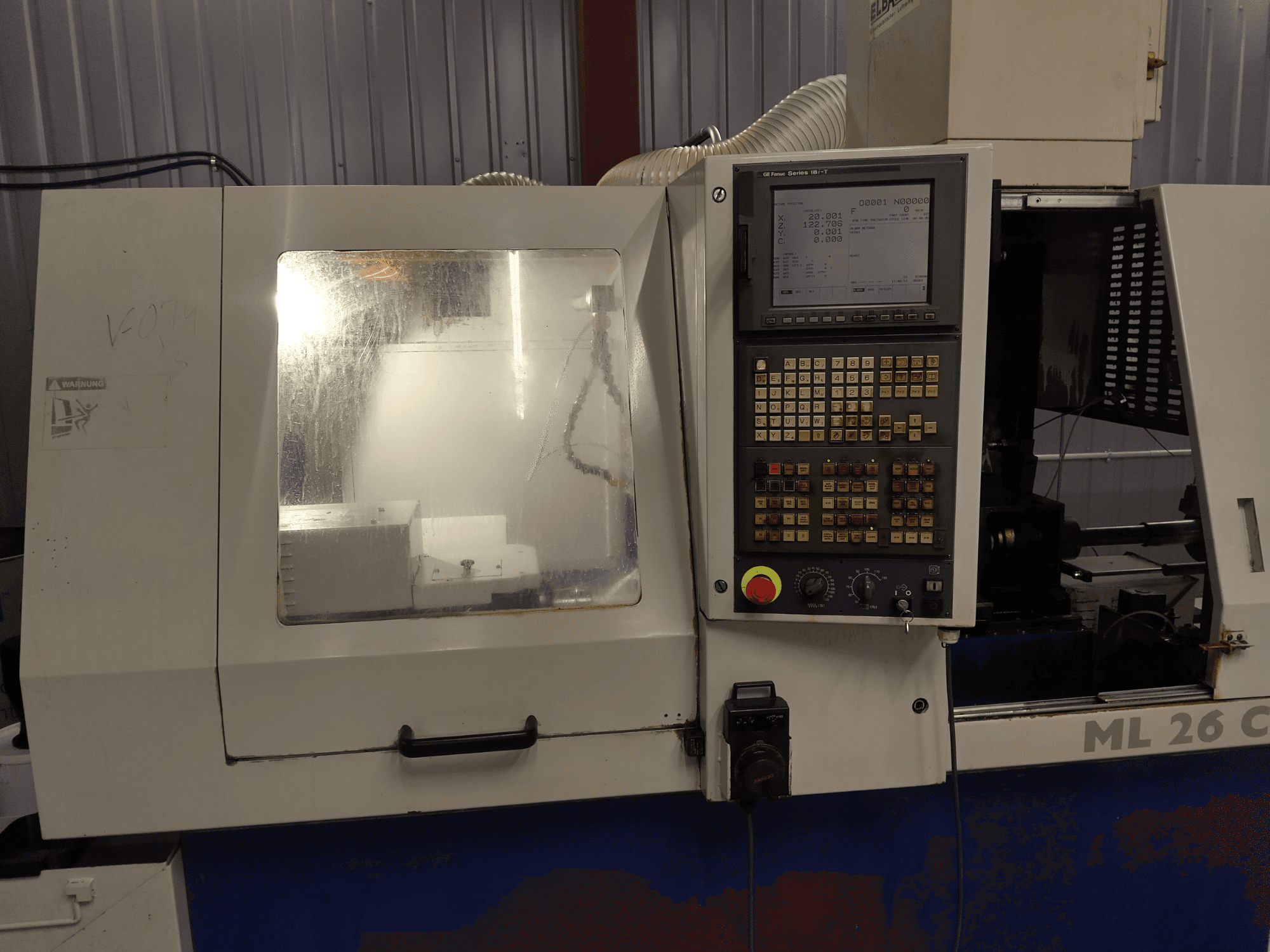 Maier ML 26 C1 Swiss Type Turning Machine, front view, showing control panel and machining area with clear protective cover.