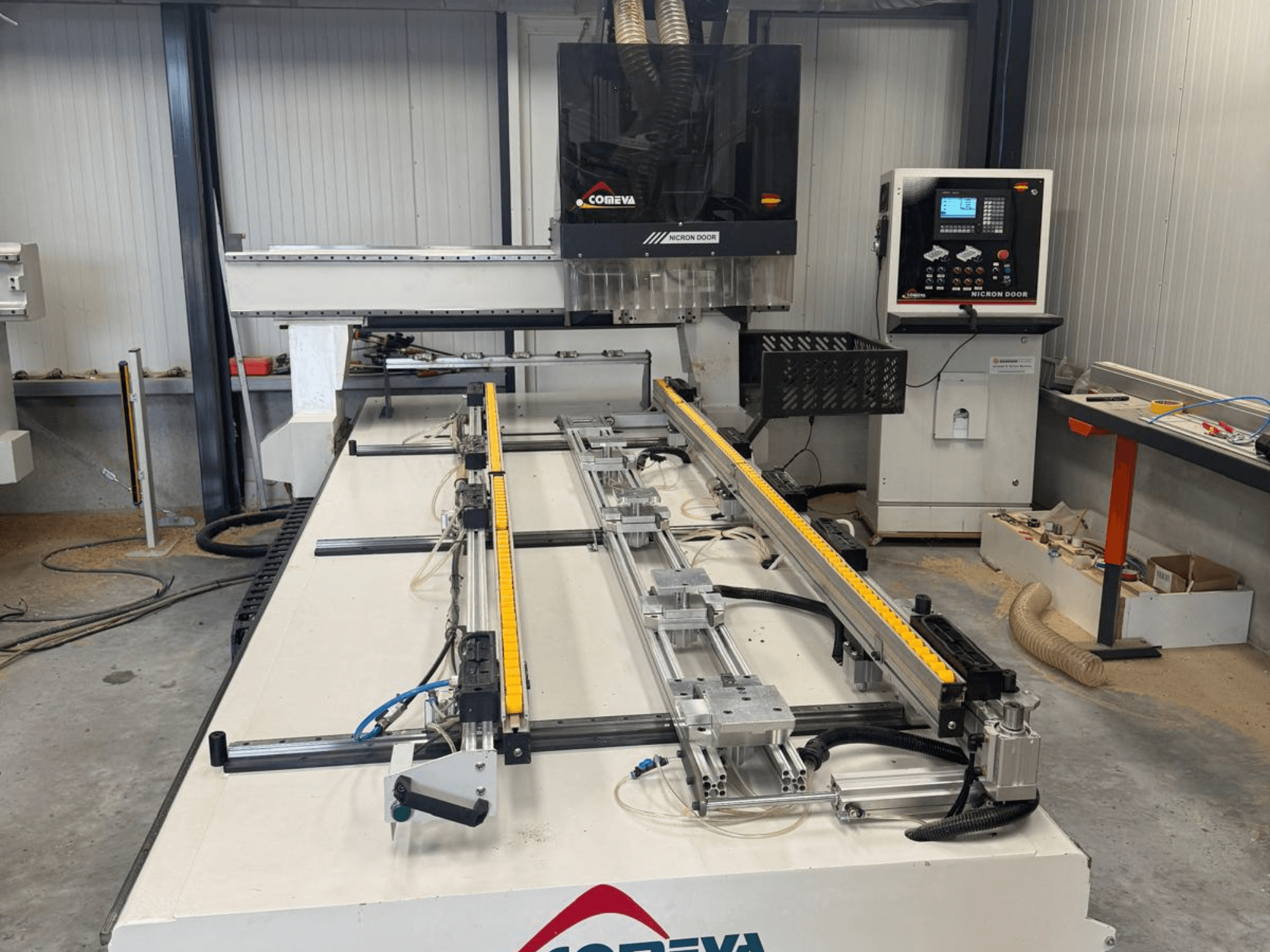 CNC Wood Machining Centre COMEVA MEX V 2100x3260 front view, featuring a workstation, control panel, and guide rails.