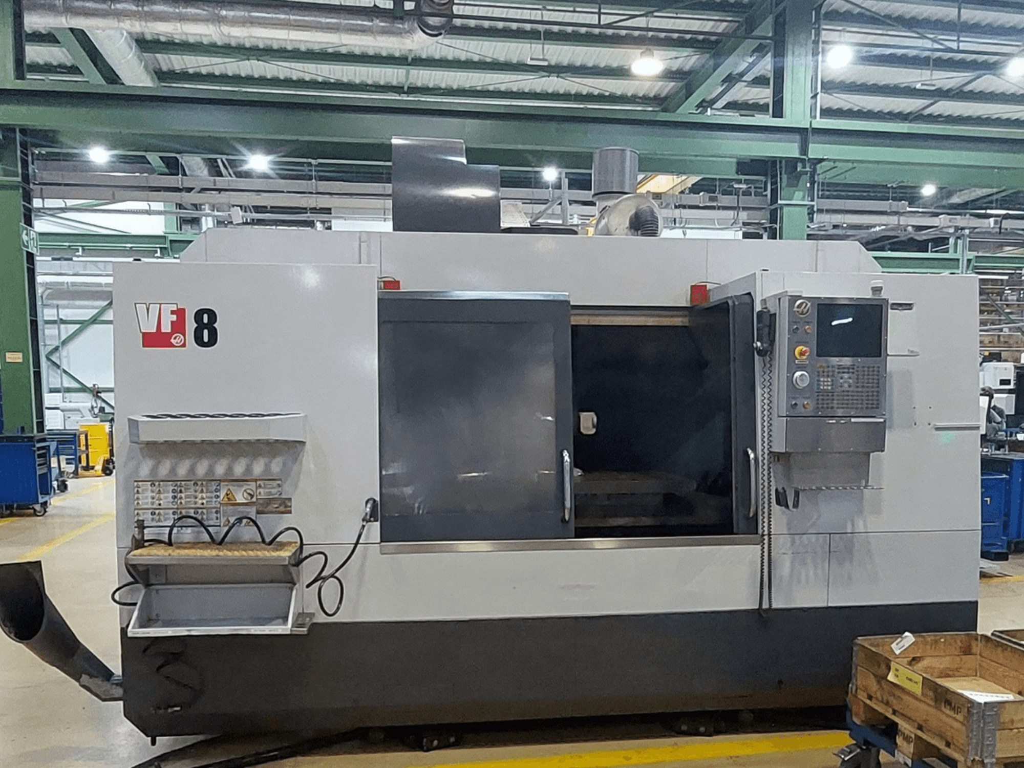 HAAS VF-8 vertical machining centre, front view; features control panel and loading area, designed for precise machining tasks.