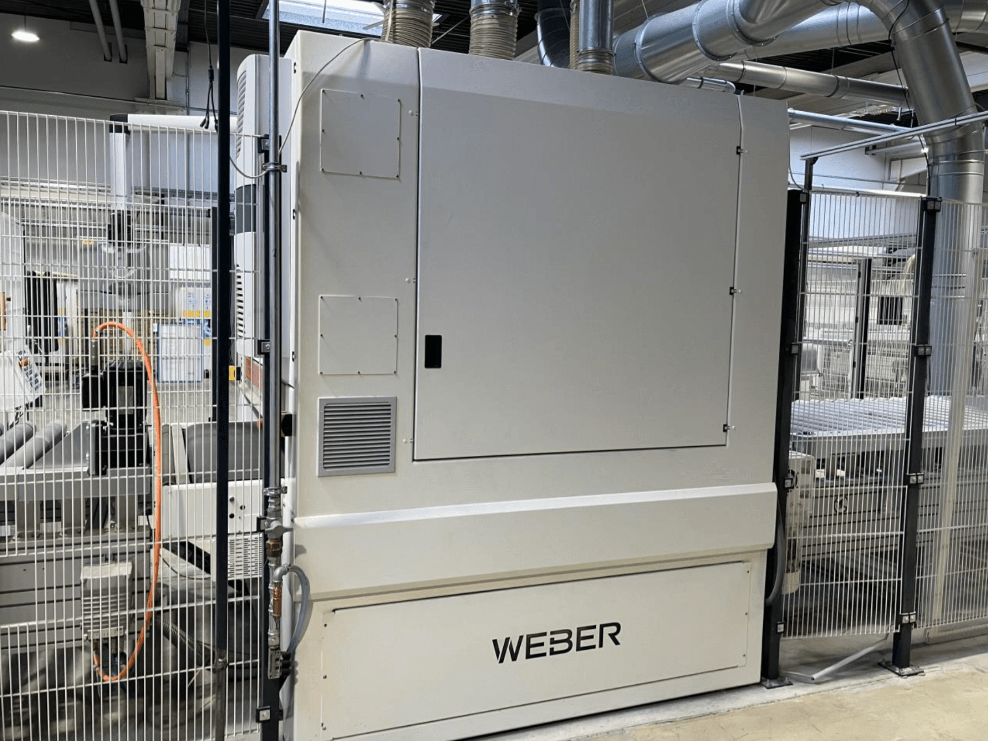Front view of HYMMEN JUPITER JPT C 680/548 wood production line, featuring the WEBDER component and visible safety fencing.
