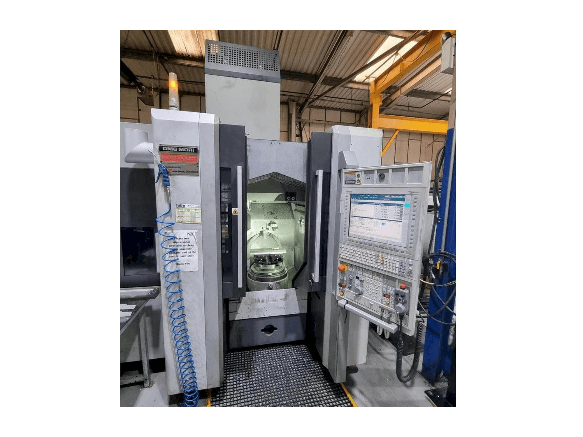Front view of DMG MORI NMV3000 DCG machine