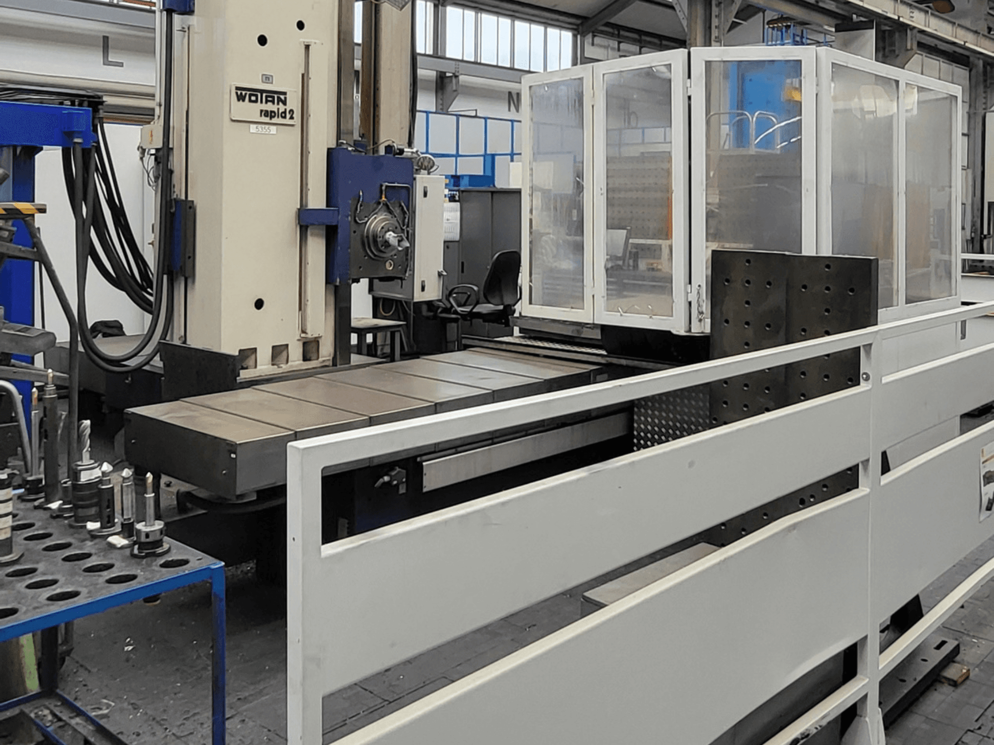 Horizontal machining centre WOTAN Rapid 2R/6-1500/2 shown in front view, featuring a large work table and protective enclosure.