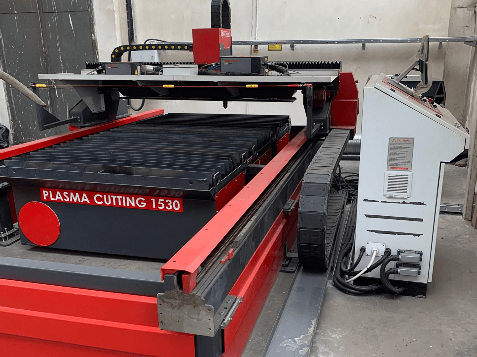 DENER PL 1530 plasma cutting machine, side view showing cutting table, control panel, and electrical connections.