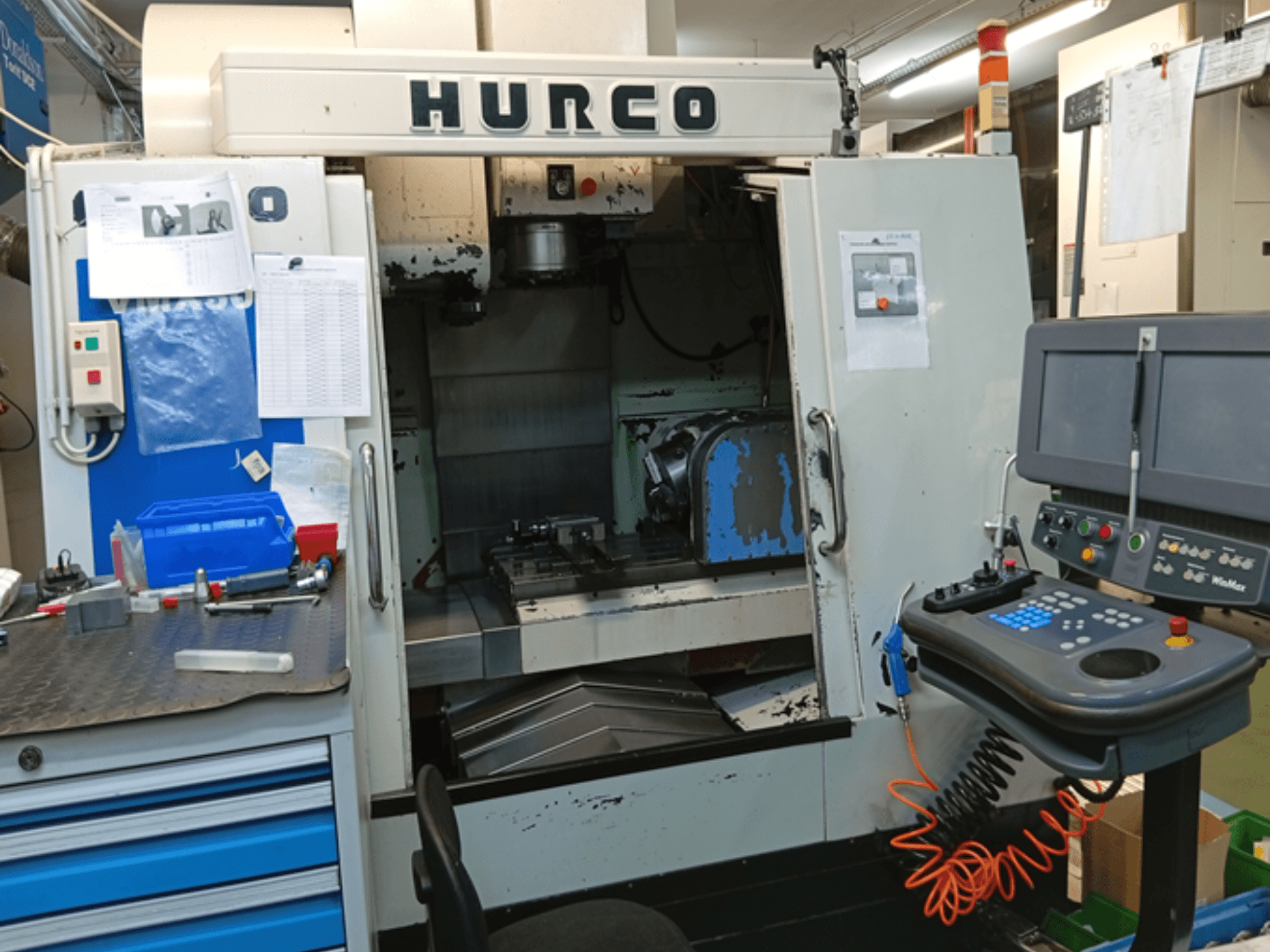 Hurco VMX 30T vertical machining centre, front view, showing control panel, workspace, and partially open door.