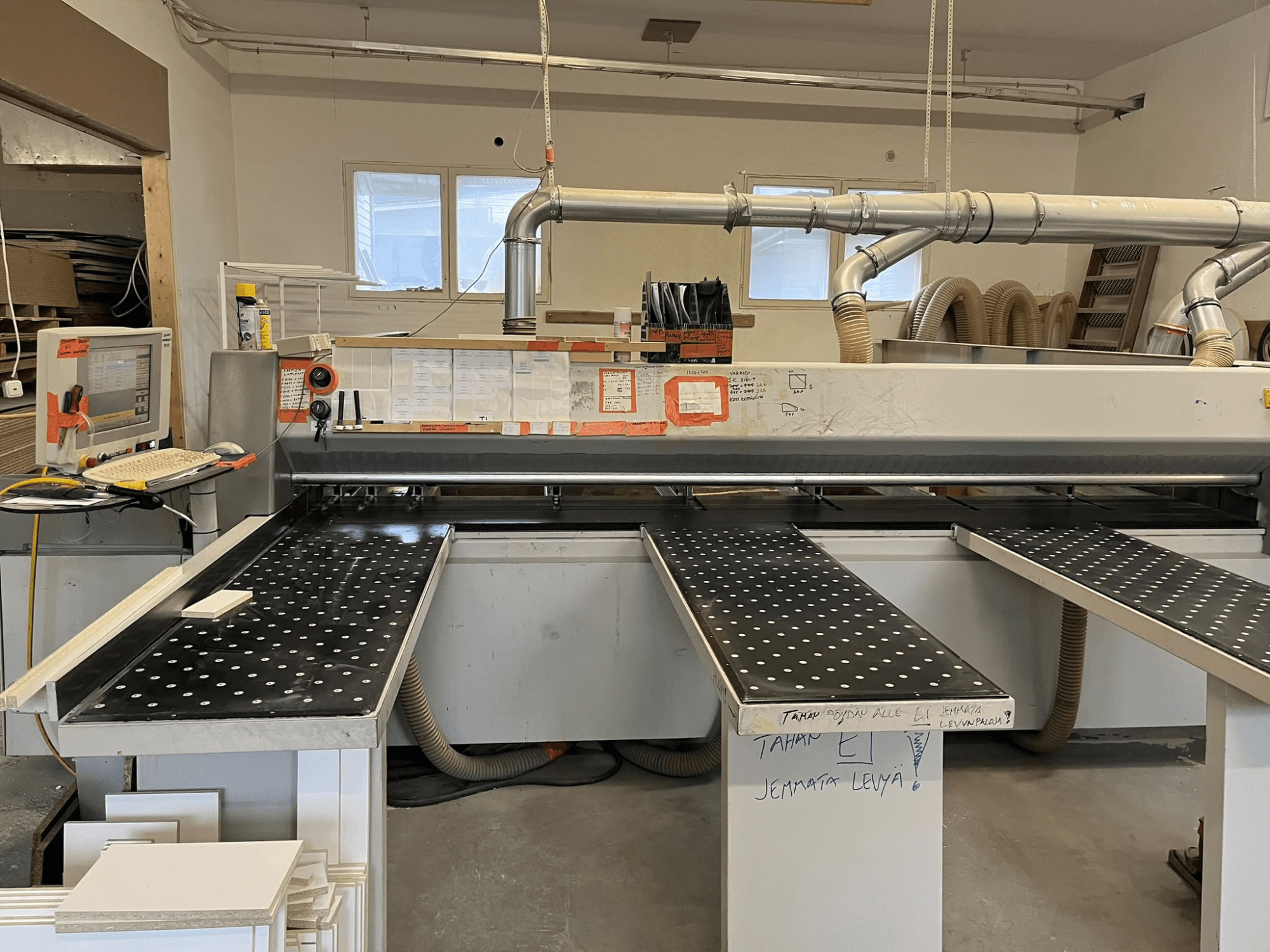 HOLZHER CUT70 panel saw in a workshop, viewed from the front, showing a cutting table and control panel.