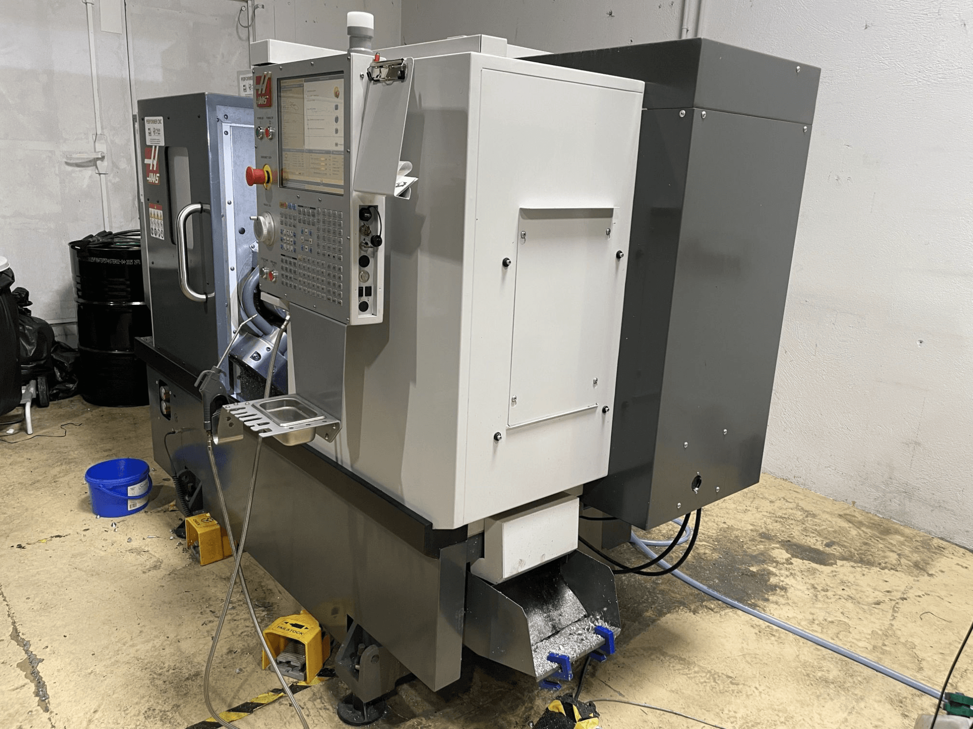 HAAS ST-15Y horizontal turning machine in a workshop, featuring a control panel and a robust industrial design.