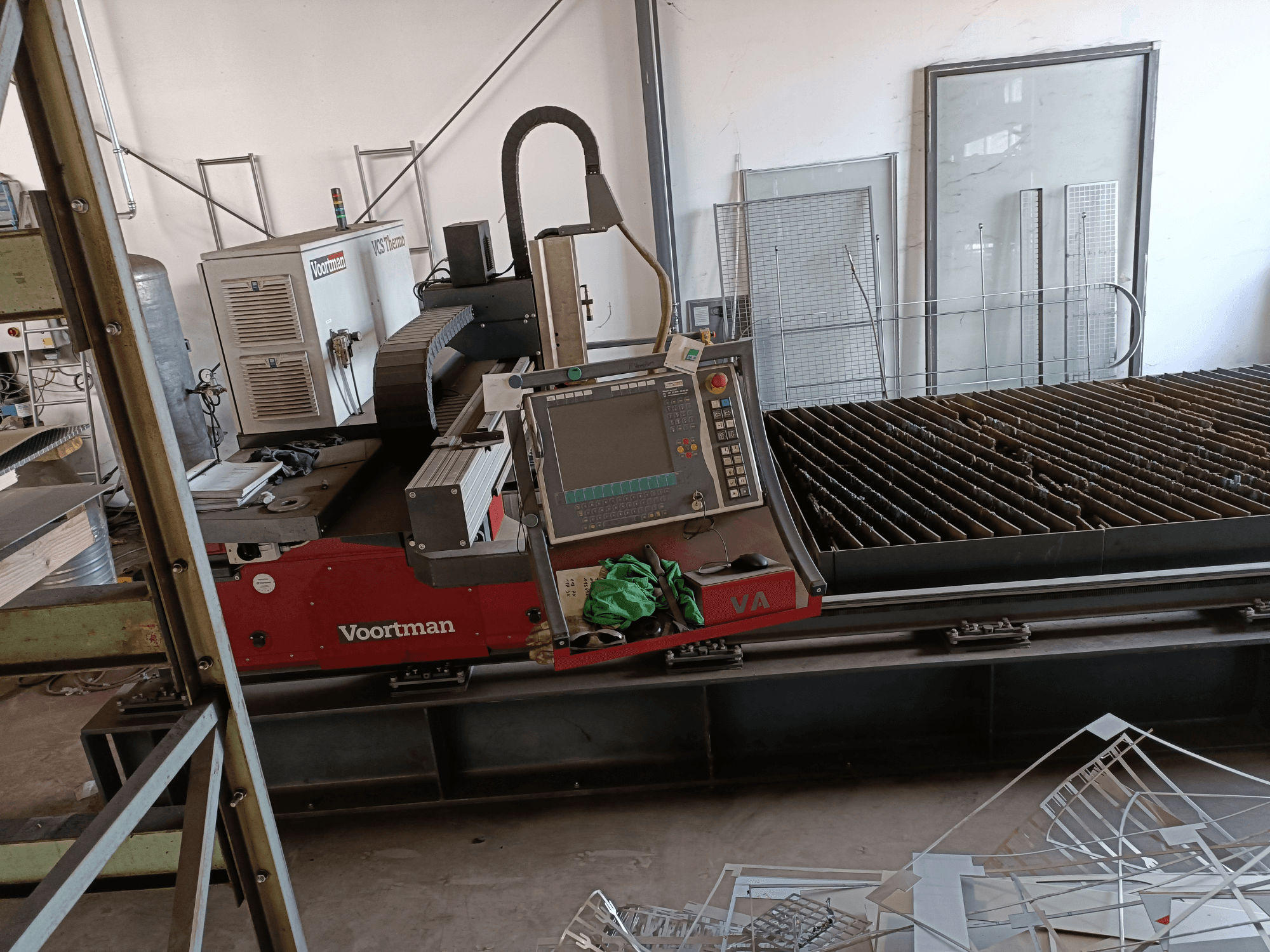 VOORTMAN VCS Thermo plasma cutting machine, front view, featuring control panel, cutting bed, and surrounding workspace details.
