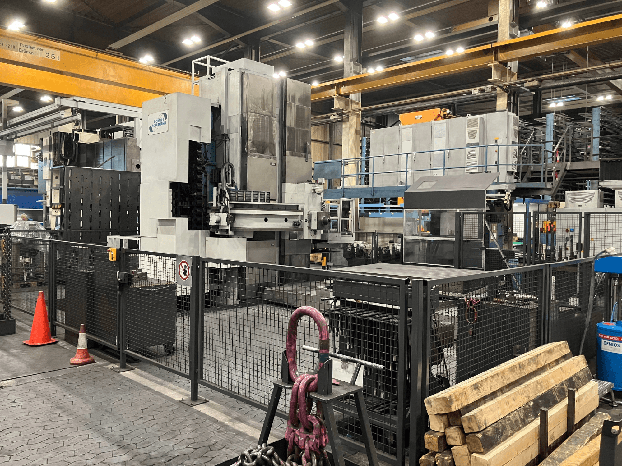 Boring machine DÖRRIES SCHARMANN Heavycut 1.2 TDV4 in a factory setting, side view with safety barriers and tools nearby.