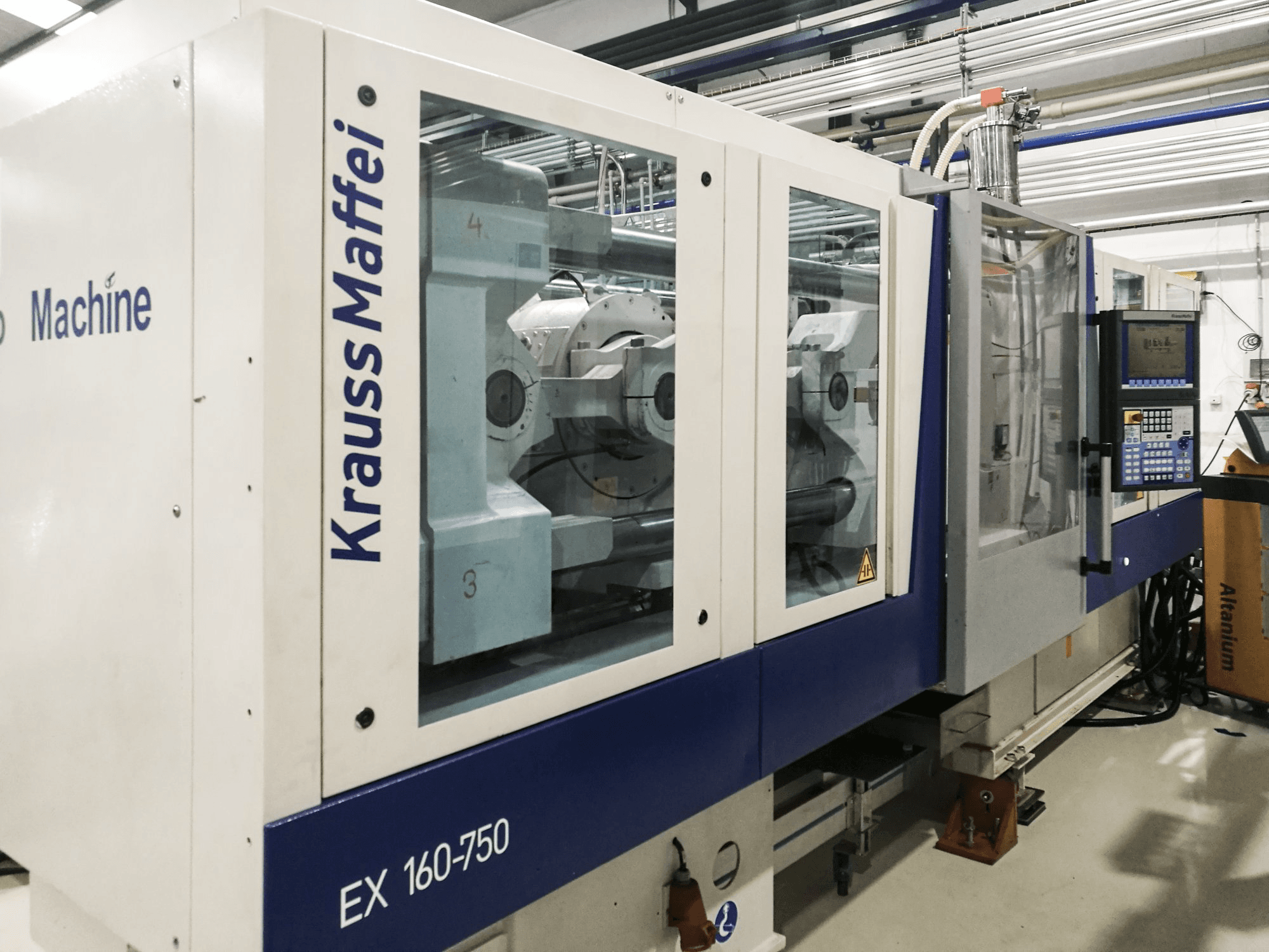 Left view of Krauss Maffei 160-750 EX Machine