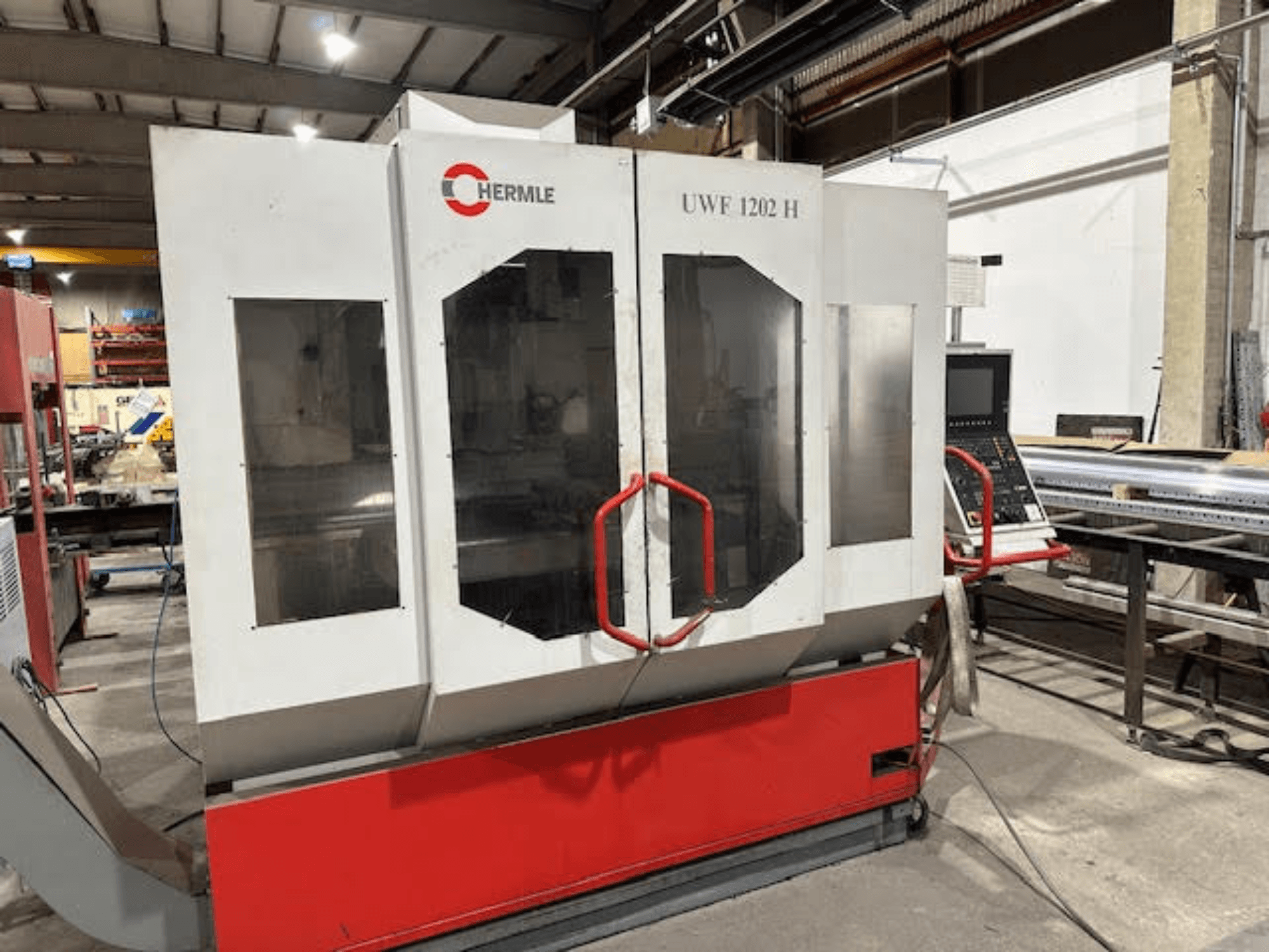 HERMLE UWF 1202 H Universal Machining Centre, front view showcasing control panel and dual glass doors.