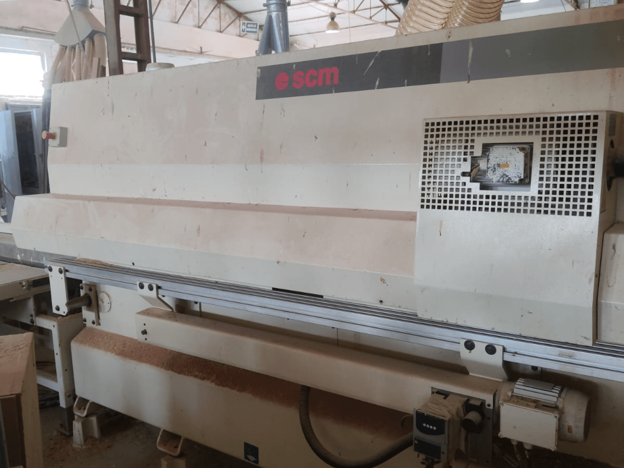 CNC Wood Machining Centre SCM Windor60, front view. Shows machine controls and dust collection, with wood shavings underneath.