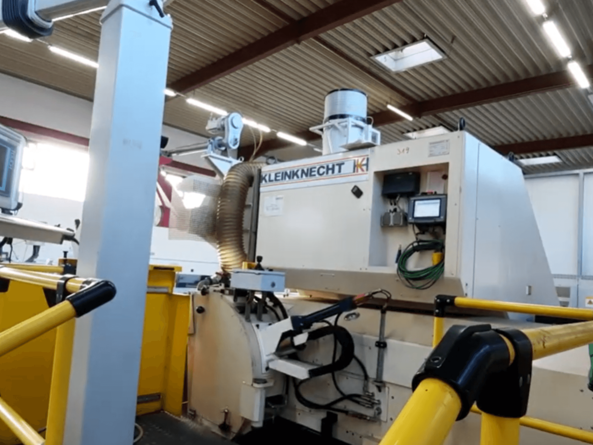 Cylindrical grinding machine WALDRICH KLEINKNECHT WS III C 6.00 X 5000, shown in side view, with control panel and extraction system.