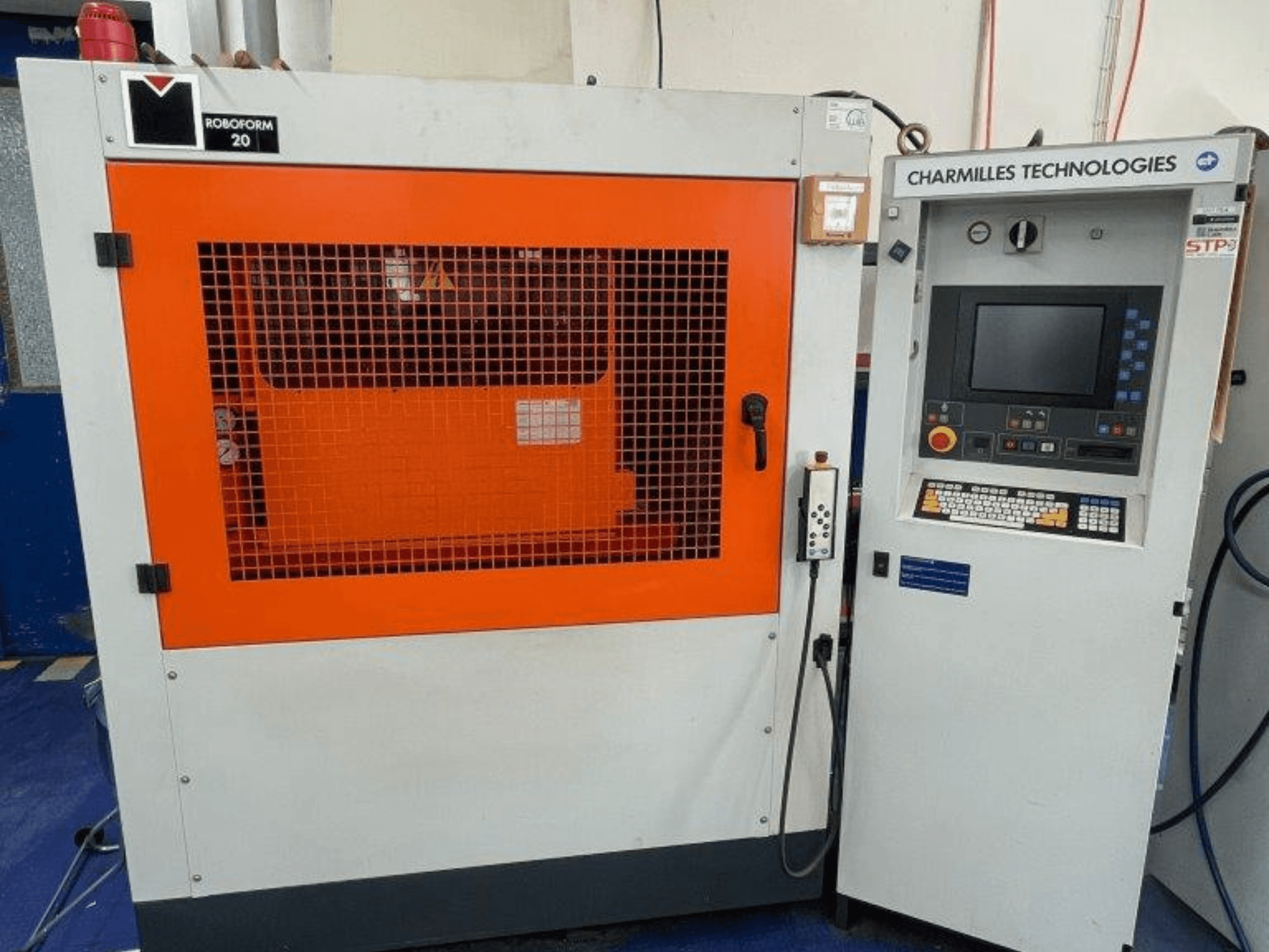 AgieCharmilles Robofrom 20 die-sinking EDM machine, front view with control panel and orange protective grille.
