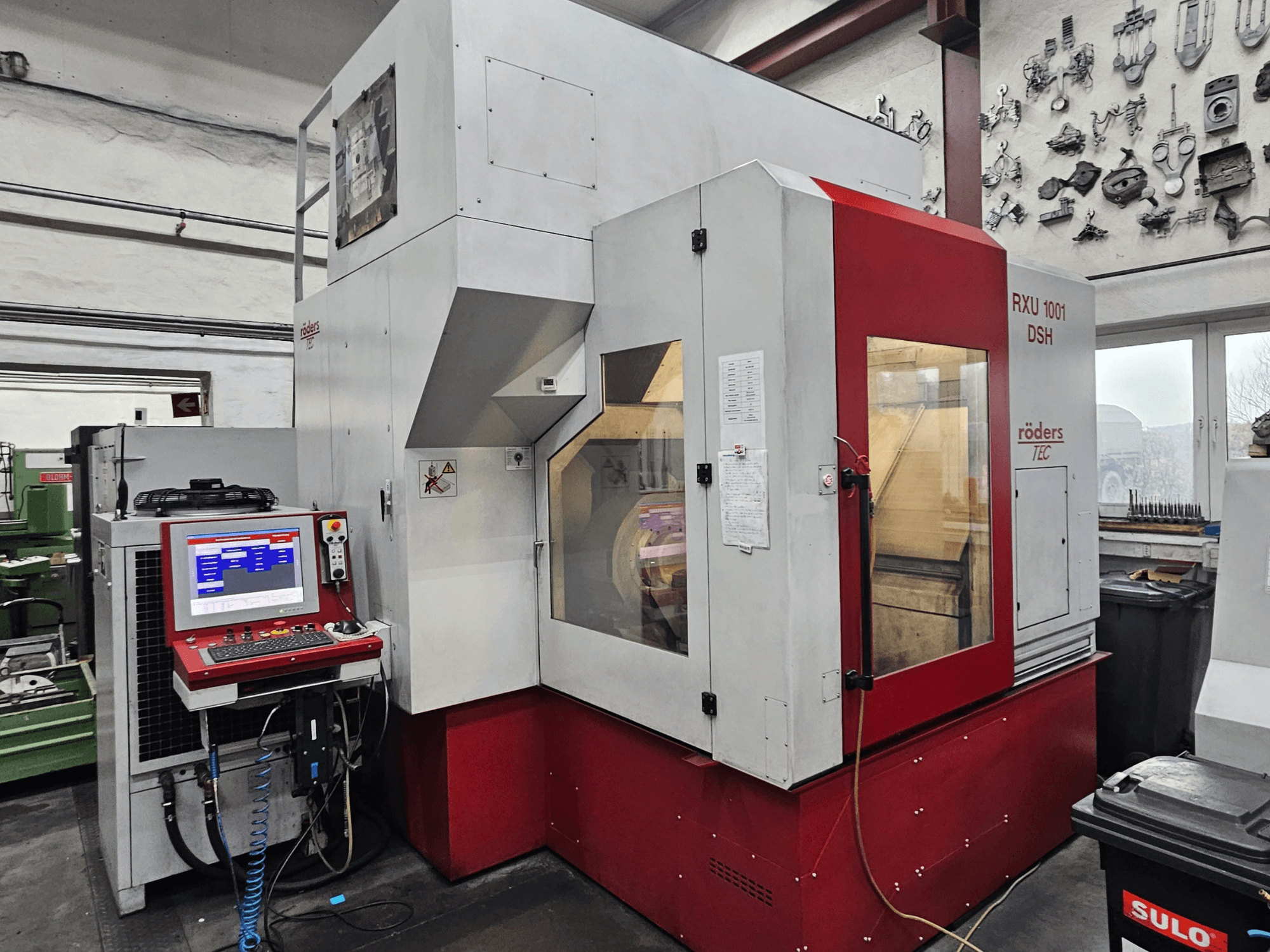 RÖDERS RXU 1001 DSH vertical machining centre, front view showing control panel and machine details in a workshop setting.