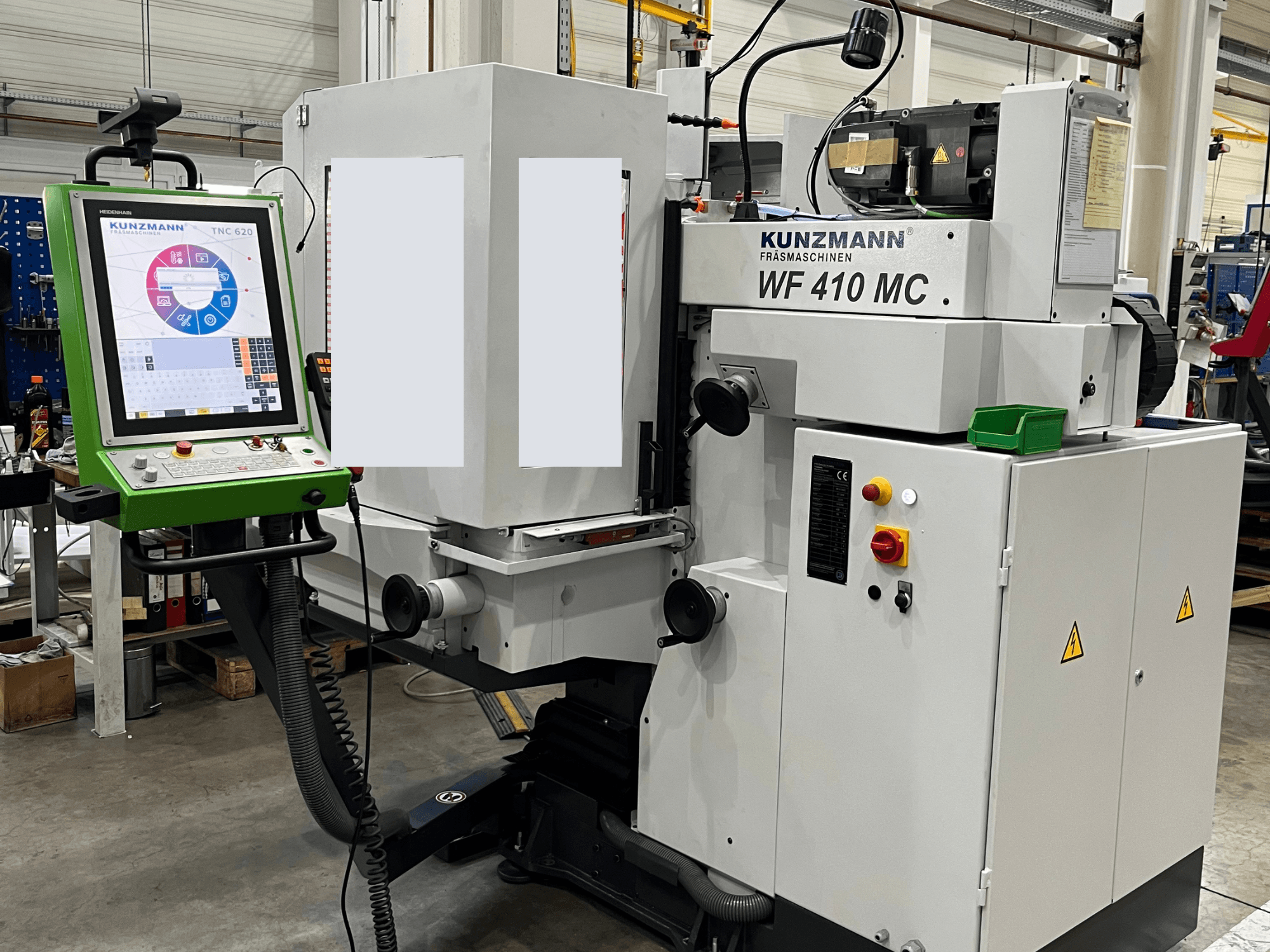 Vertical machining centre KUNZMANN WF 410 MC, front view with control panel and operational buttons visible.