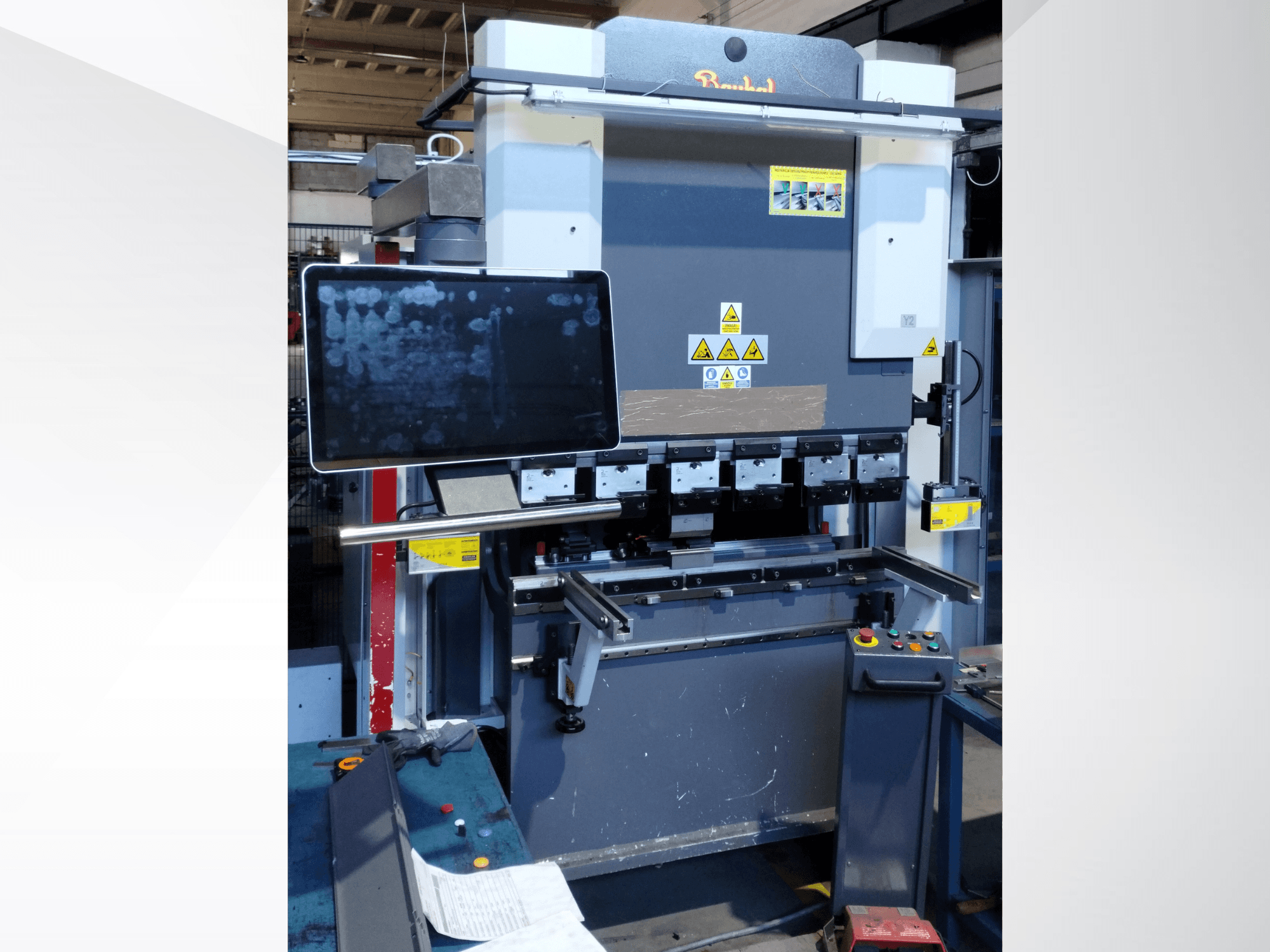 Baykal APHS 125040 press brake, front view, showcasing control panel, display screen, and operational components.