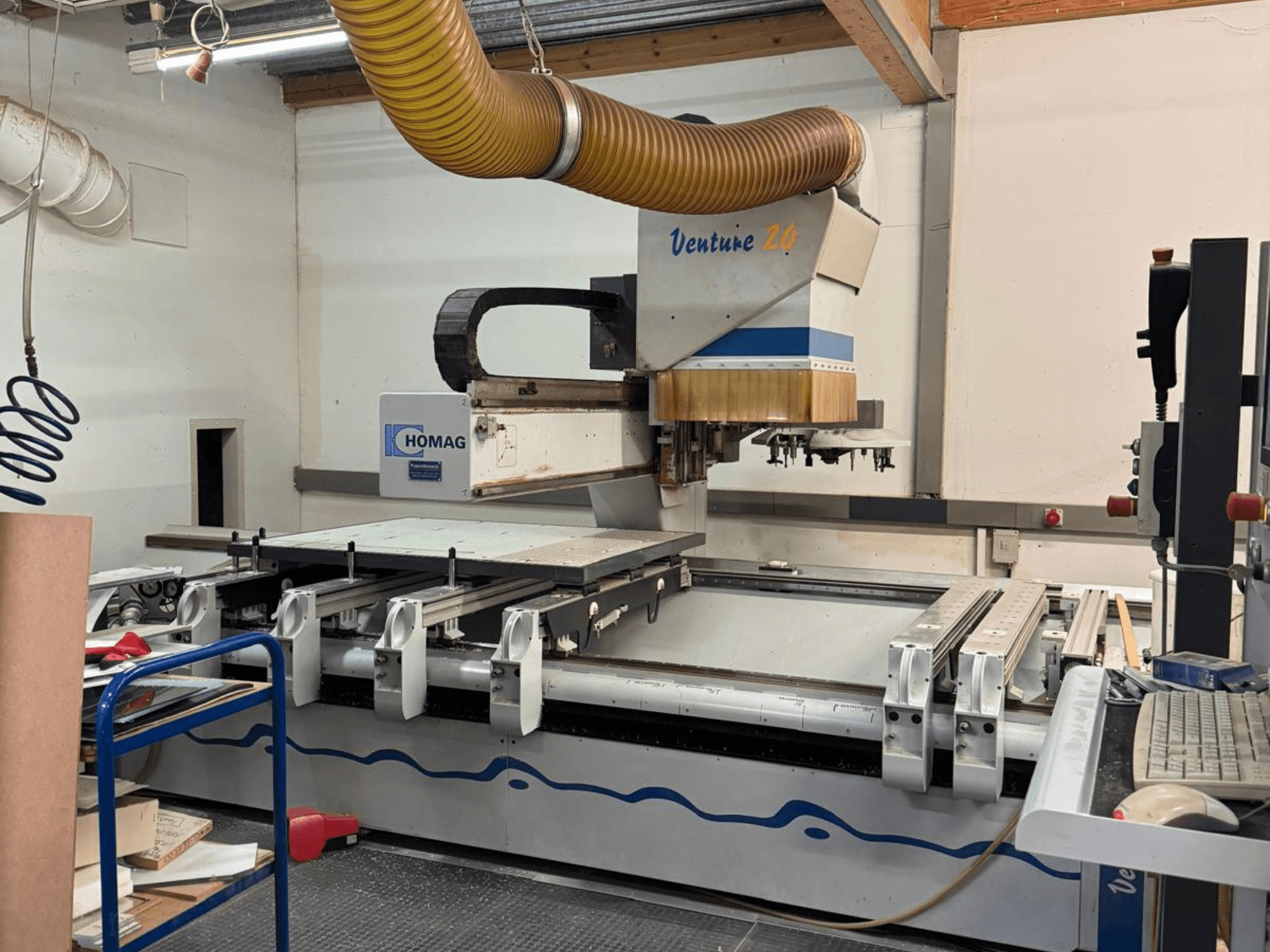 HOMAG Venture 20 CNC machine, front view, with a large cutting table, vacuum system, and control panel.