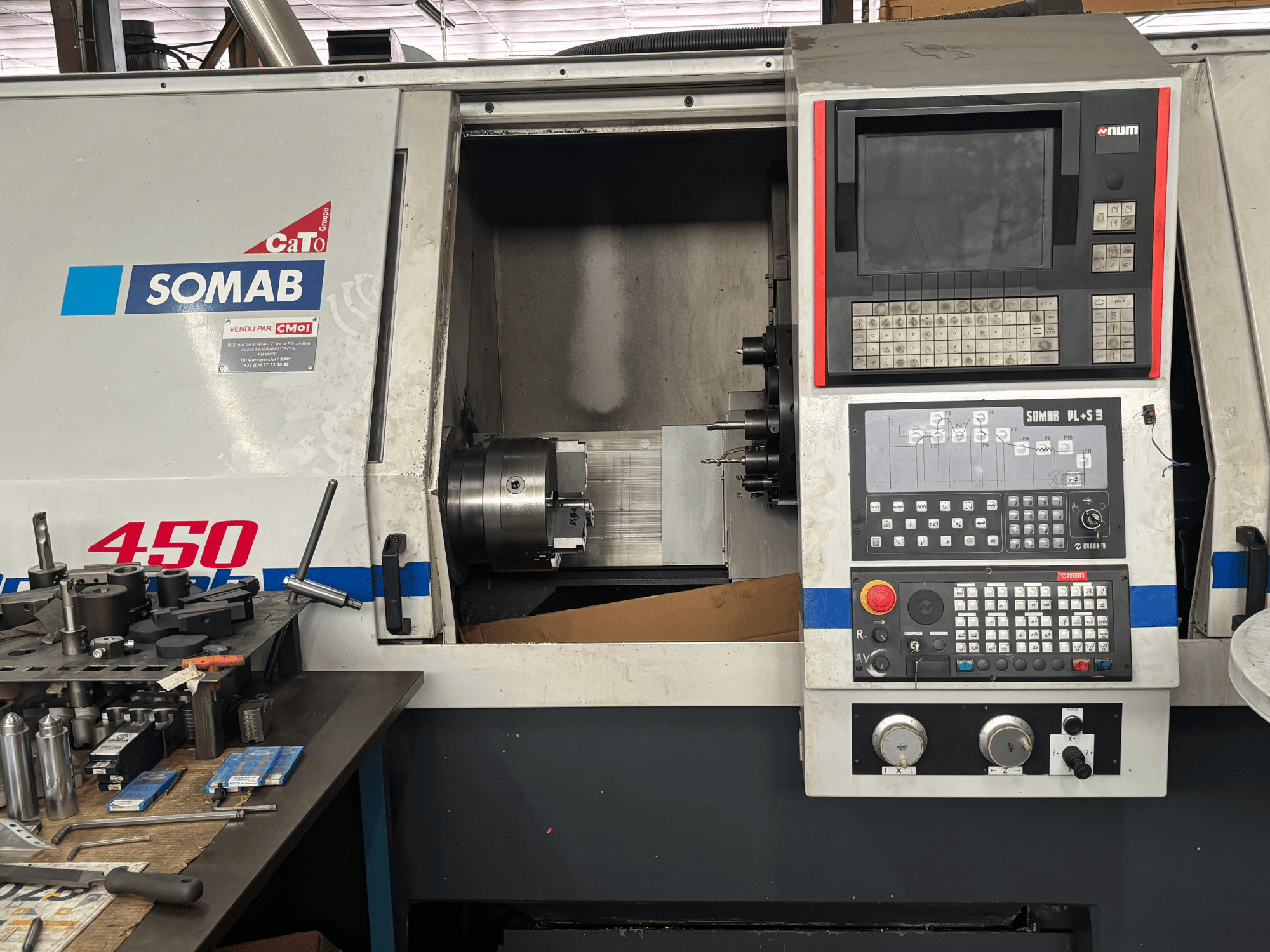 White SOMAB OPTIMA 450 horizontal turning machine front view, featuring a digital control panel and mounted workpiece.