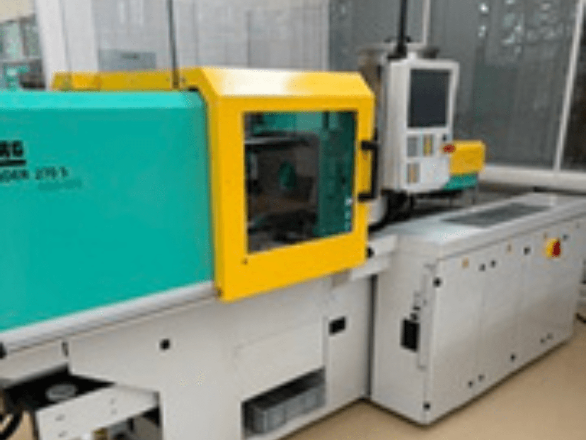 Front view of Arburg ALLROUNDER 270 S 400-100 hydraulic injection moulding machine with control panel and green-yellow casing.