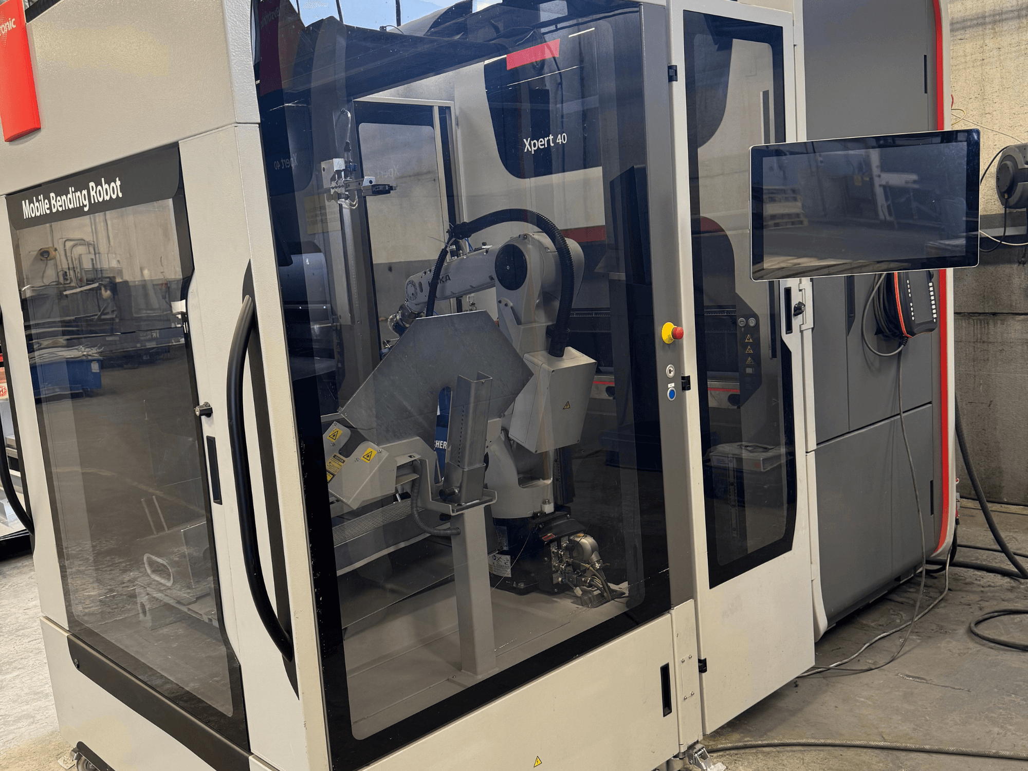 Bystronic Xpert 40/1030 press brake with mobile bending robot, front view showcasing control panel and robotic components.
