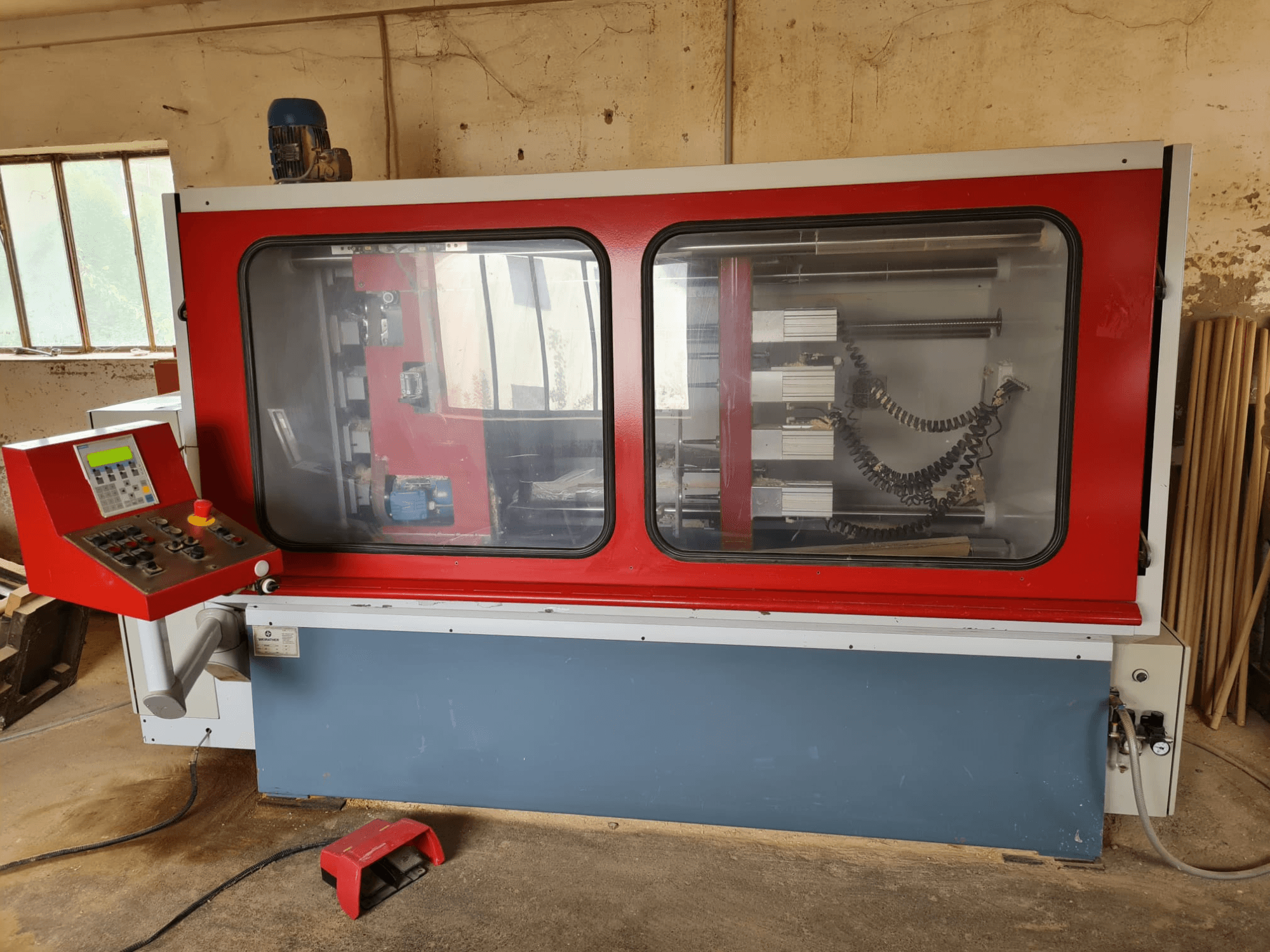 WEIRATHER KS1300/4 wood mill in front view, featuring a control panel, transparent enclosure, and visible internal components.