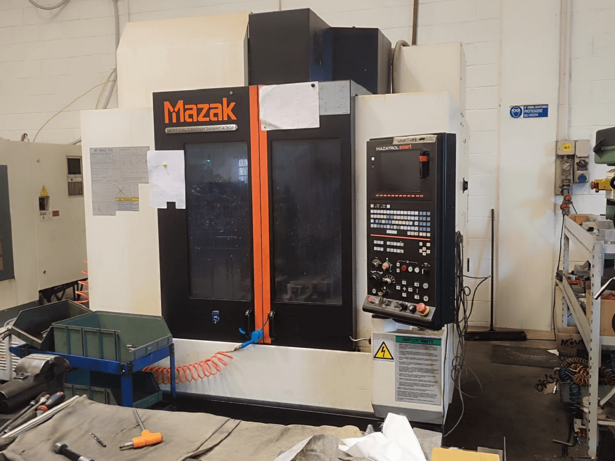 Mazak VCS 430A vertical machining center, front view showcasing control panel and operational details in workshop setting.