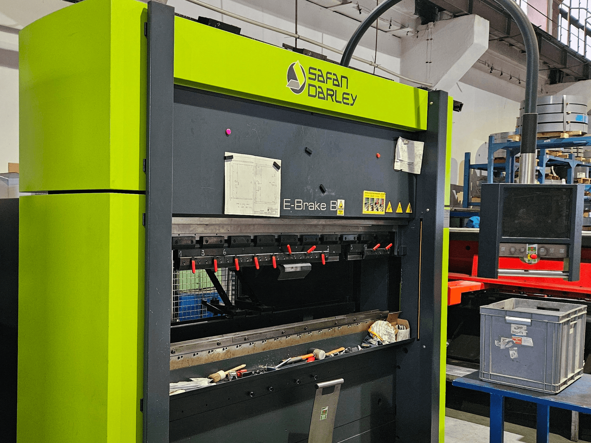 SAFAN E-Brake B 50-2050 press brake in a workshop, with red clamping tools and control panel visible from front view.