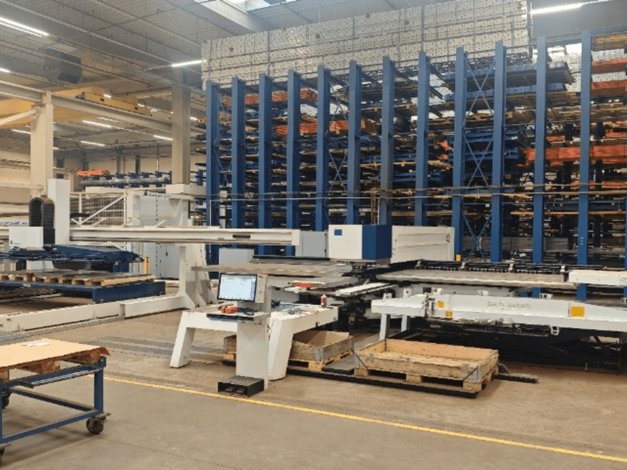 CNC punching machine TRUMPF TruPunch 5000 S12 in a workshop, viewed from the front with control panel and storage area.