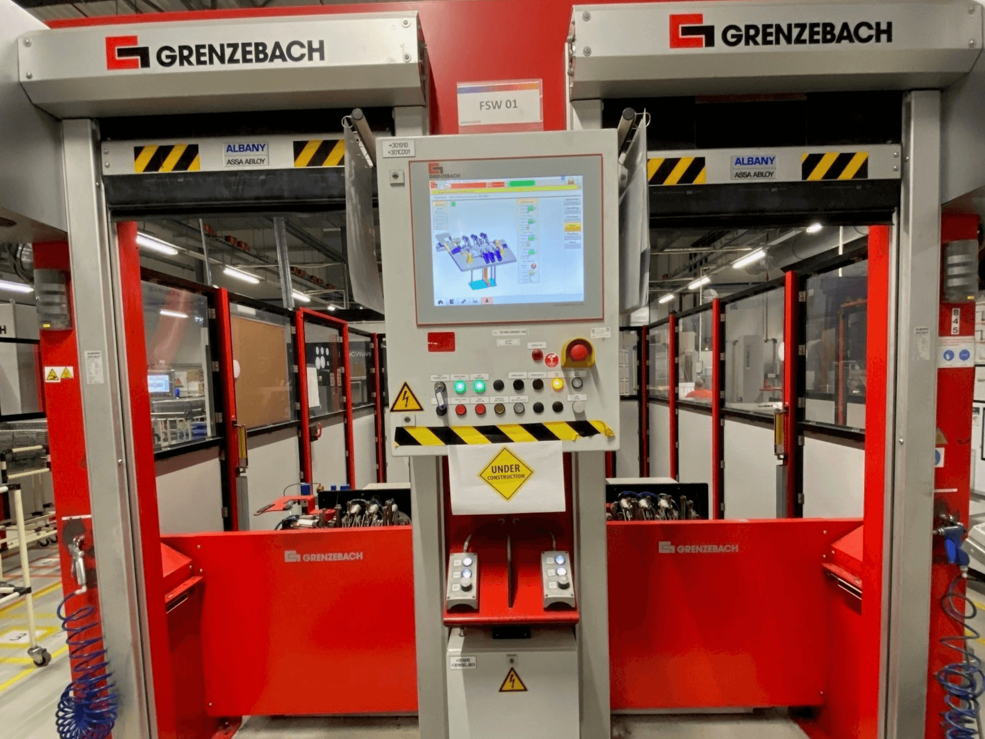 Front view of GRENZEBACH FSW GenRob 01 robot arm, featuring a control panel with touchscreen and various operational buttons.