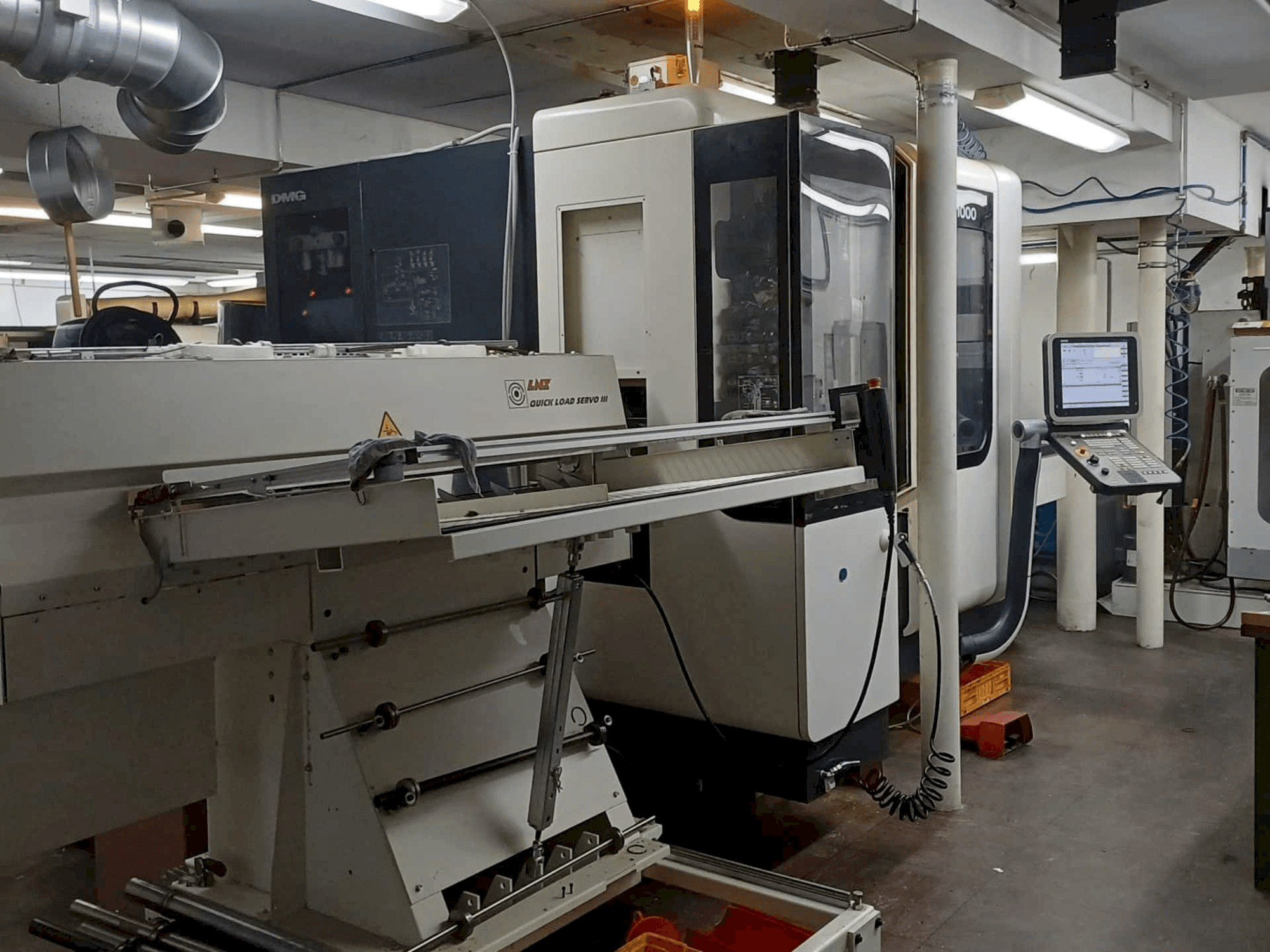 Left side view of DMG NTX1000 machine