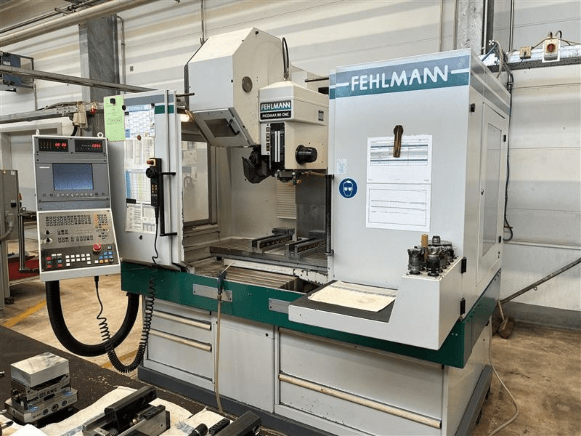 FEHLMANN PICOMAX 80 CNC-W 2/3 vertical machining center shown from the front, featuring a control panel and machining workspace.