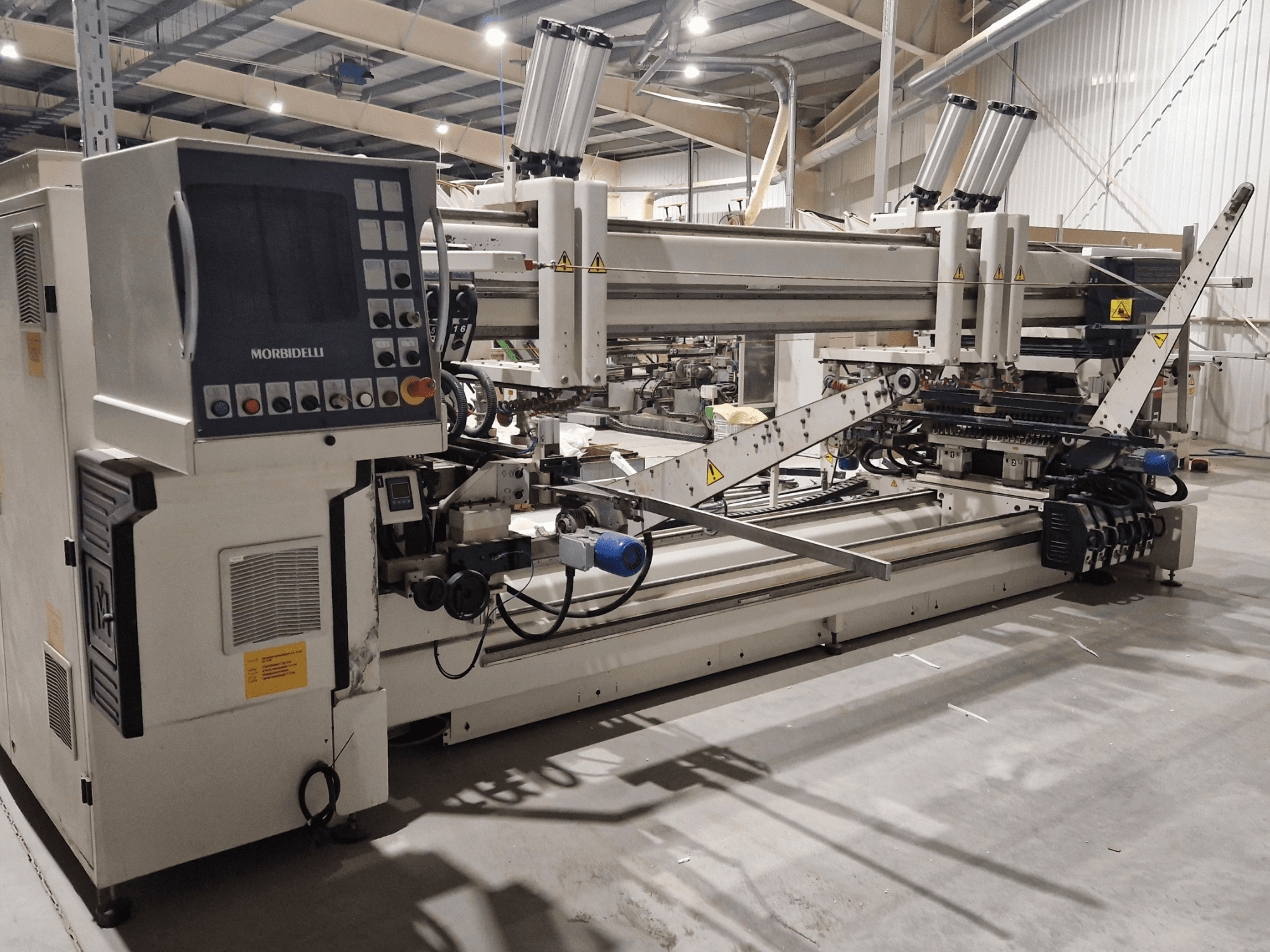 Multi-spindle drilling machine SCM Morbidelli Zenith F2, side view showing control panel and mechanical components in a workshop setting.