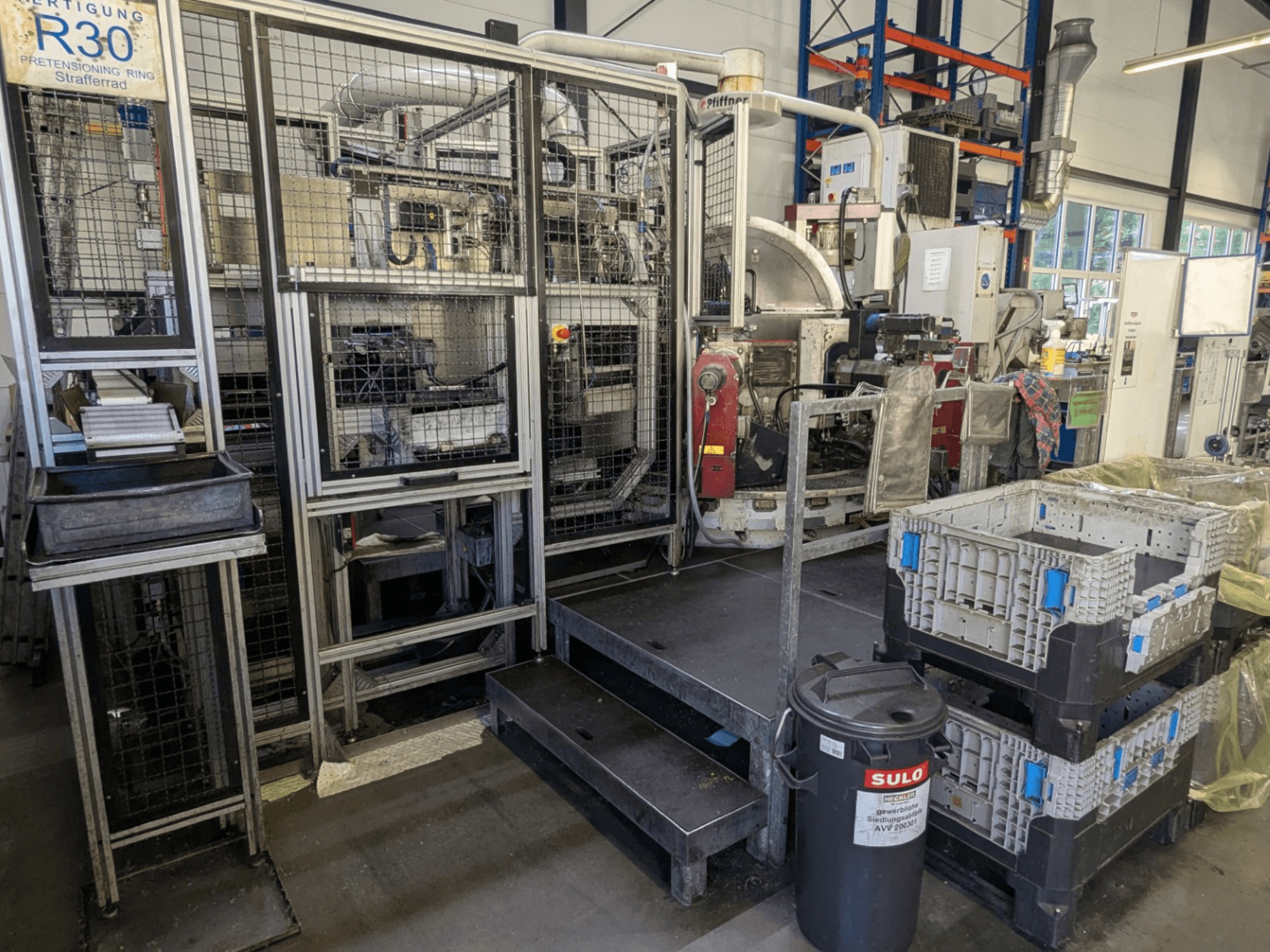 PFIFFNER HB 32/16 machine tool in a workshop, front view showing production area with bins and safety fencing.