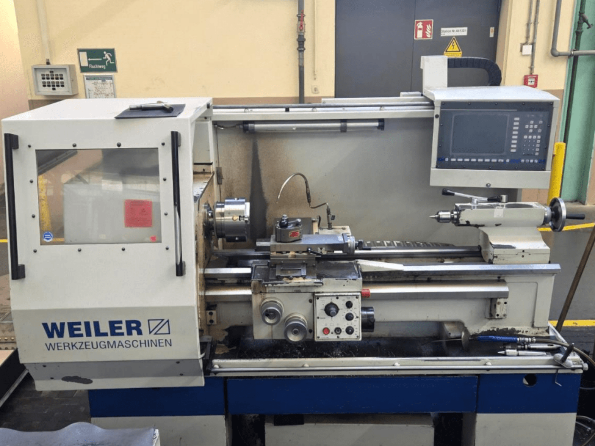 Weiler E35 D horizontal turning machine, front view, showcasing control panel, spindle, and cutting area details.