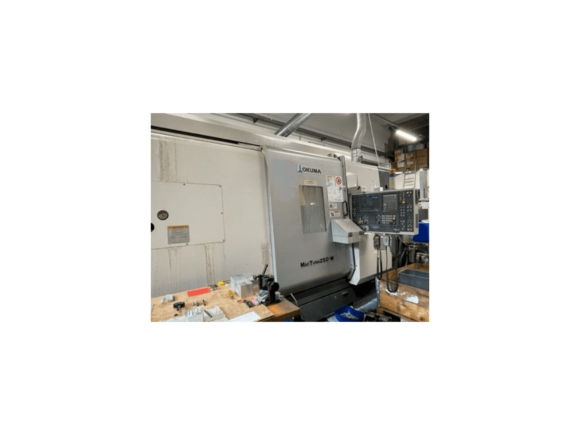 Front view of Okuma MACTURN 250W machine