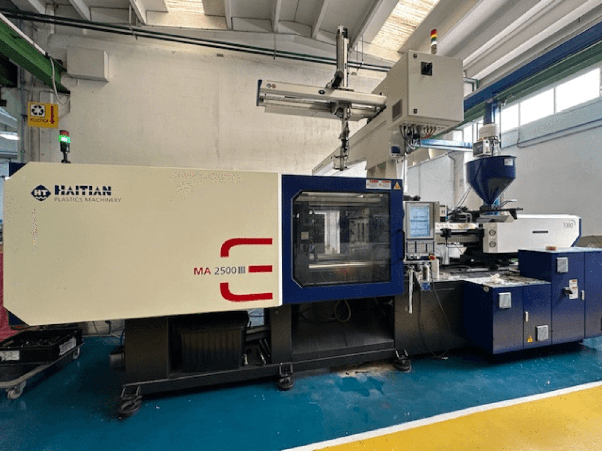 Haitian MA 2500 III hydraulic injection moulding machine, front view showcasing control panel and hopper.