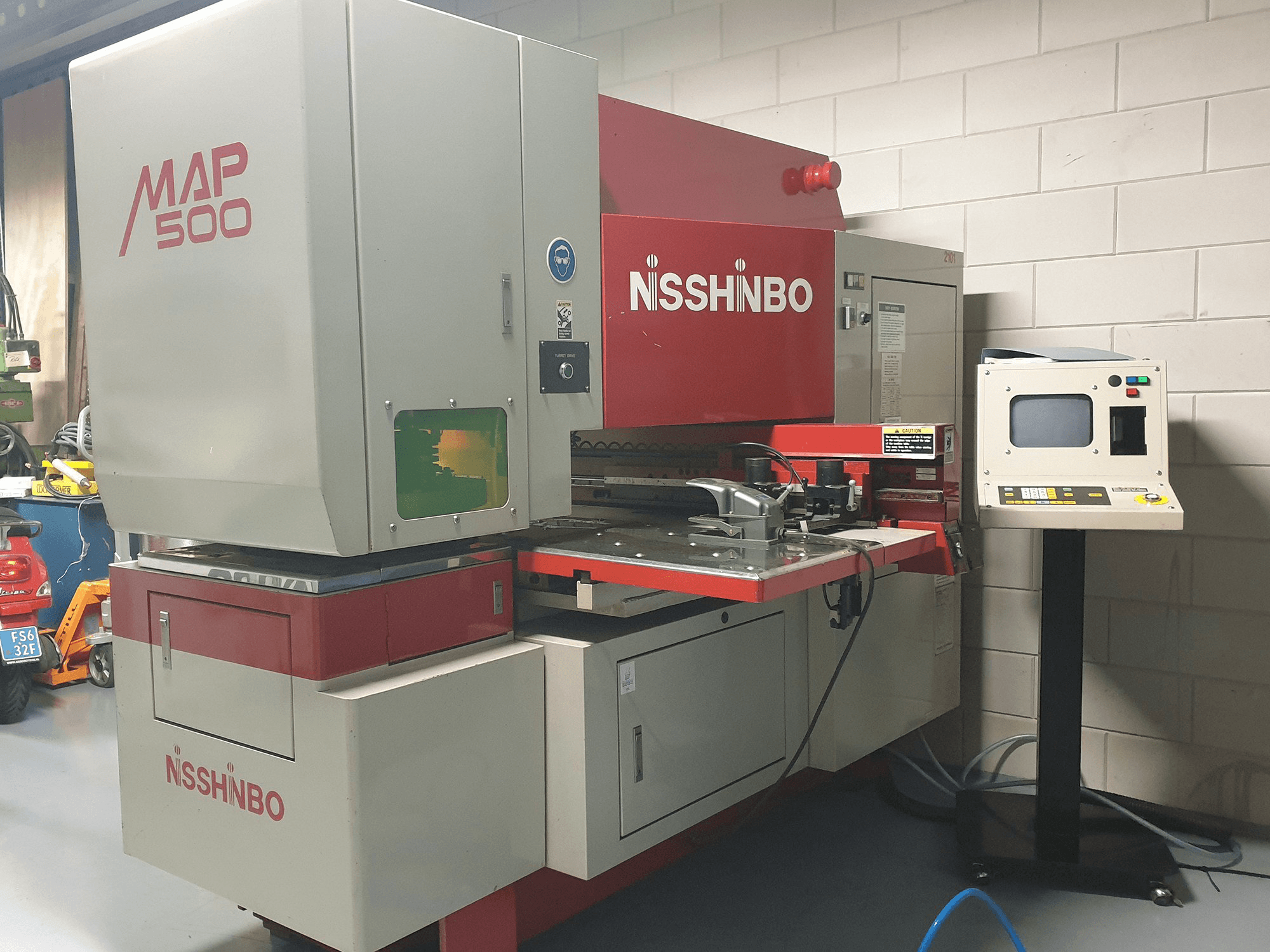 Left view of Nisshinbo MAP 500 Machine