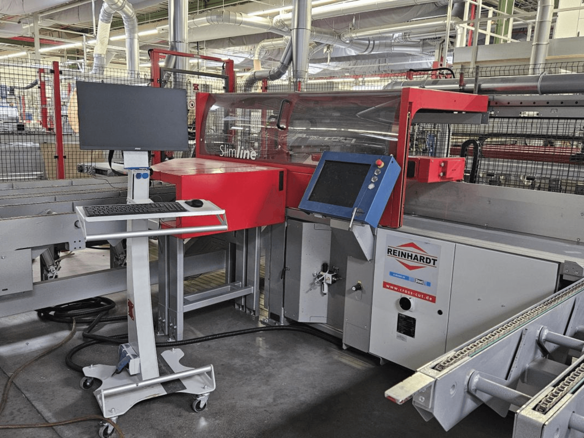 Optimizing Cross-Cut Saw Paul Reinhardt SlimLine 110, front view with control panel and monitor for operation setup.