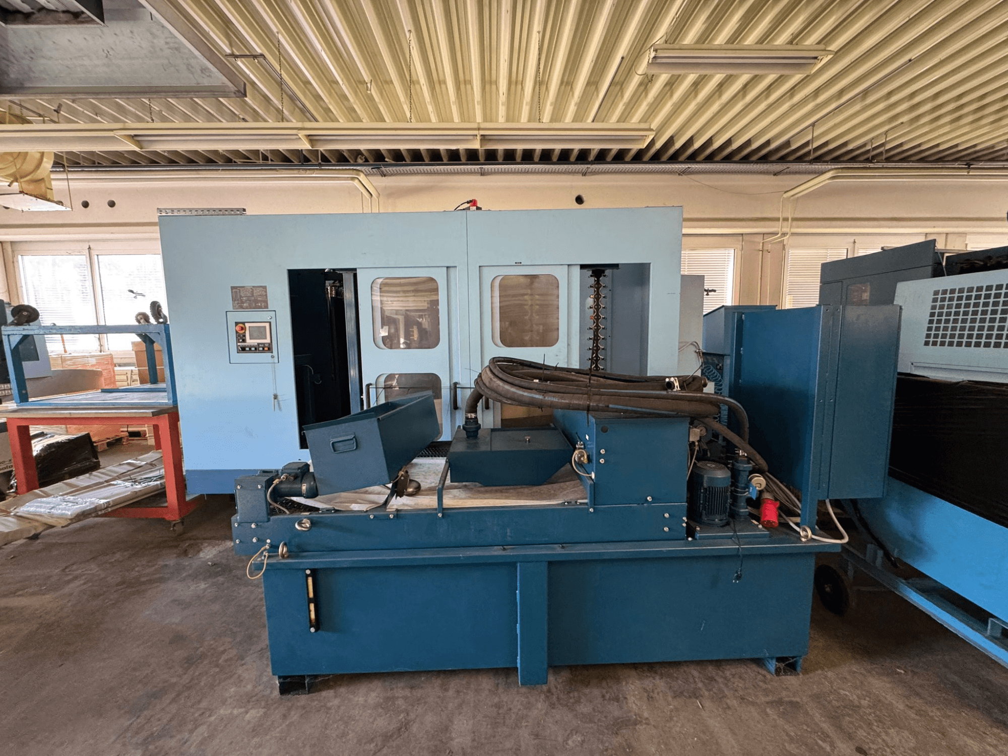Matsuura H. Plus 405 horizontal machining centre in blue, front view, showcasing control panel and machine components.