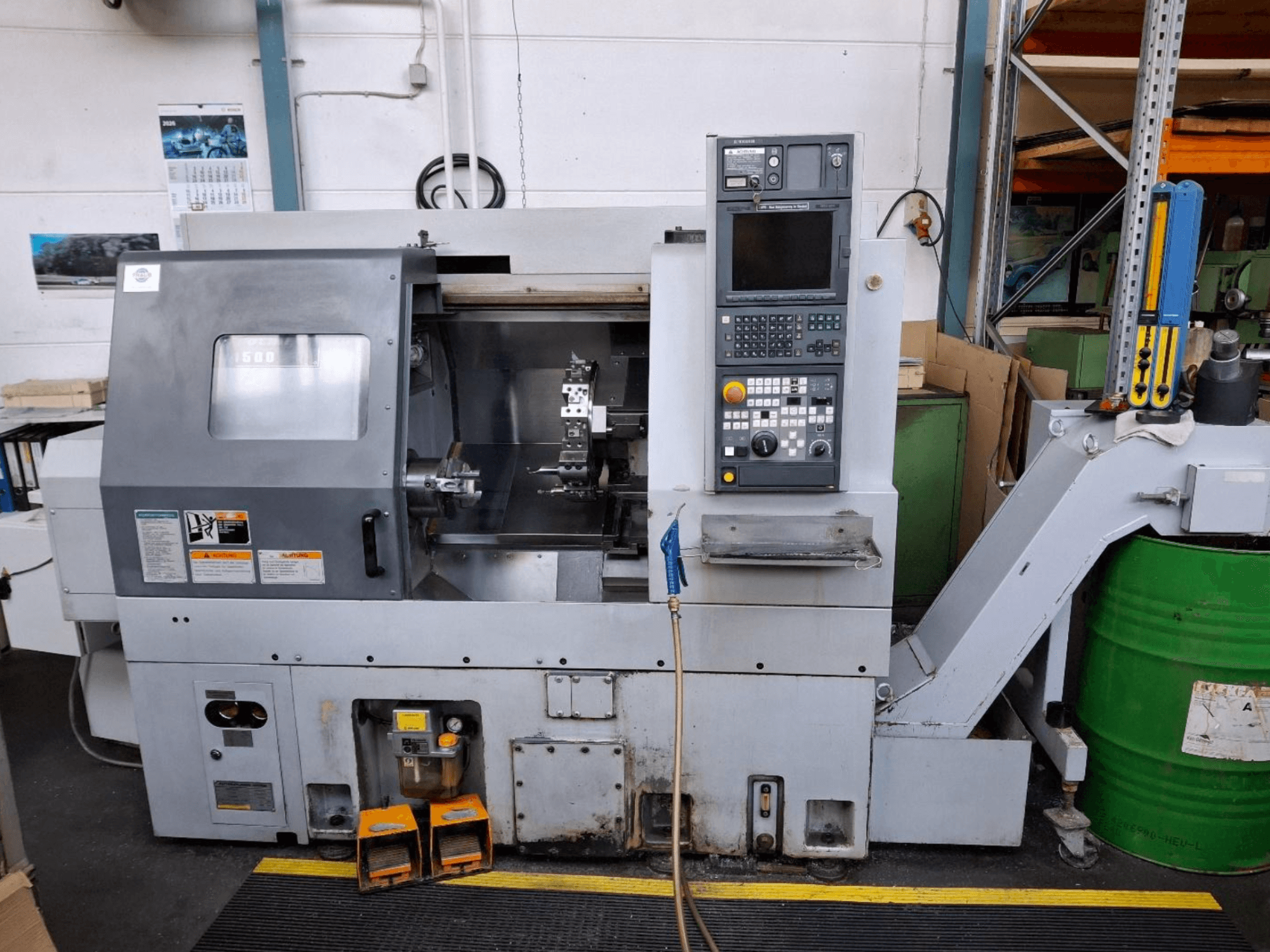 MORI SEIKI CL 1500 T horizontal turning machine, front view with control panel, visible tools, and operational display.