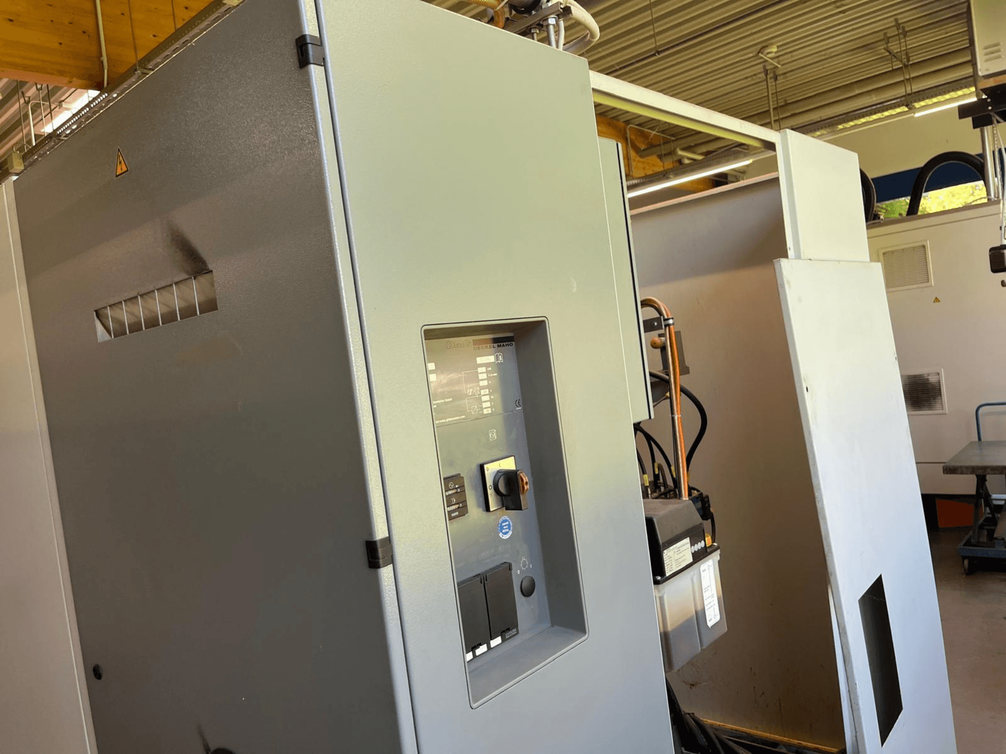 DMG DECKEL MAHO DMC 63 V vertical machining centre, front view showing control panel and access door.